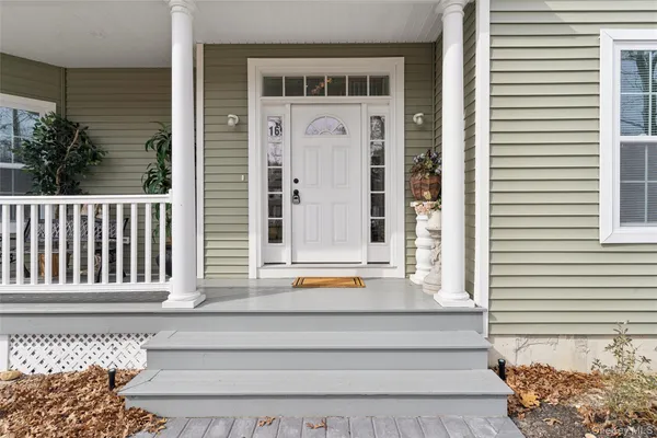a view of a building with entryway and wooden floor
