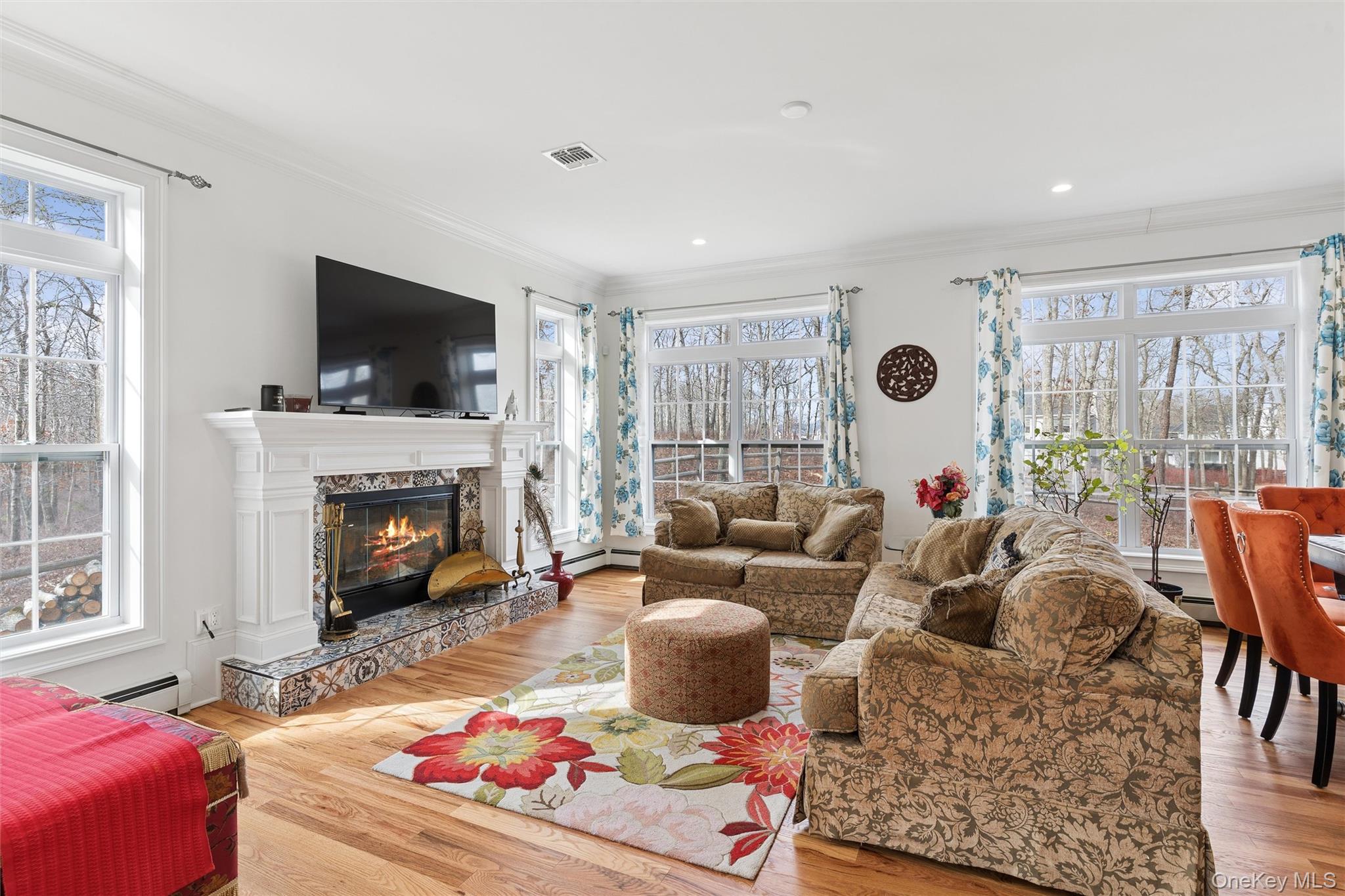 16 Gateway Court Hampton Bays, NY 11946 - Photo 4 of 30 a living room with furniture fireplace and flat screen tv