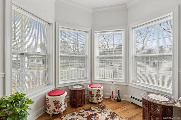 a bedroom with furniture and a window