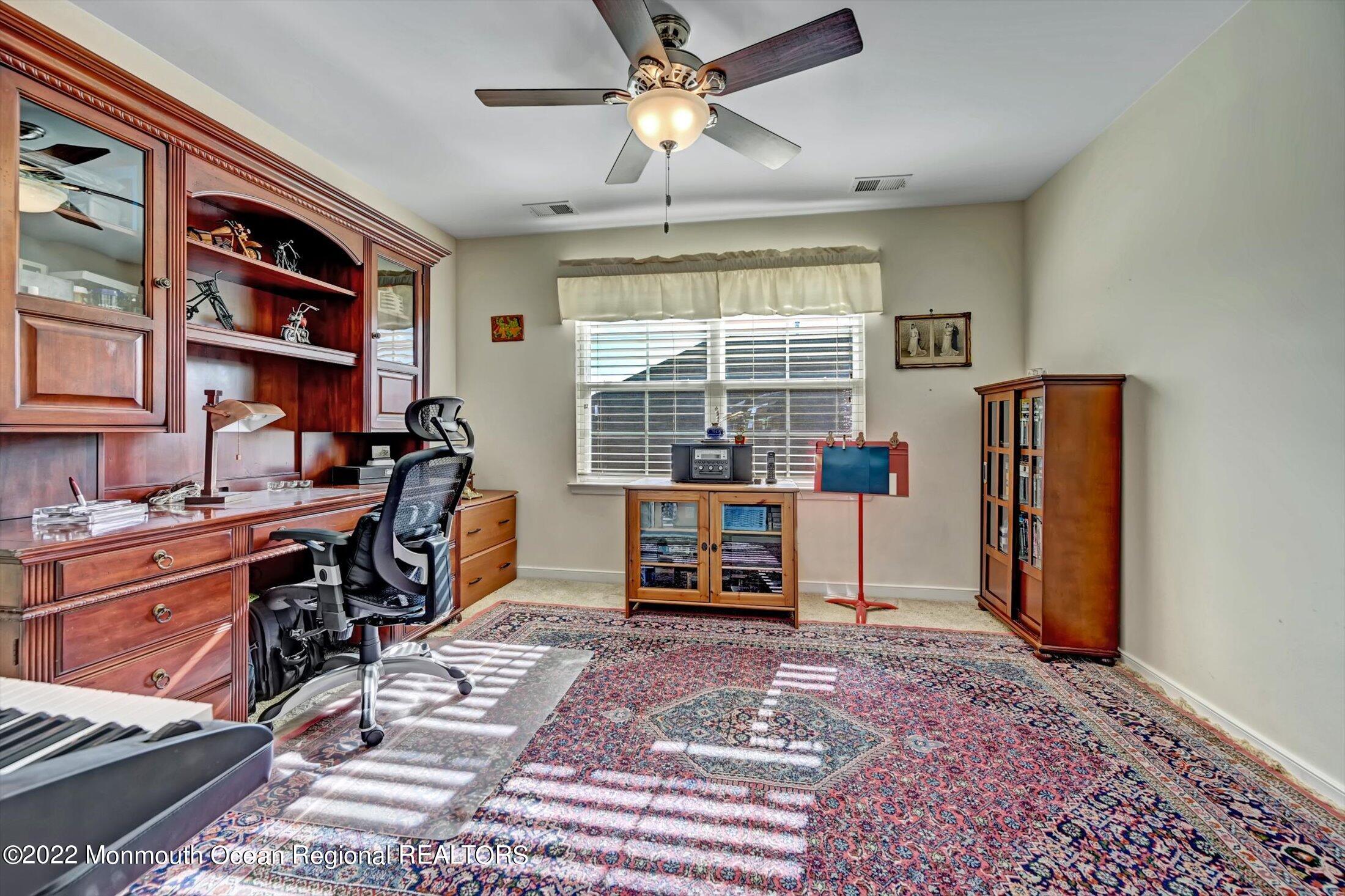20 East Francesa Court Farmingdale, NJ 07727 - Photo 35 of 78 a workspace with furniture and a window