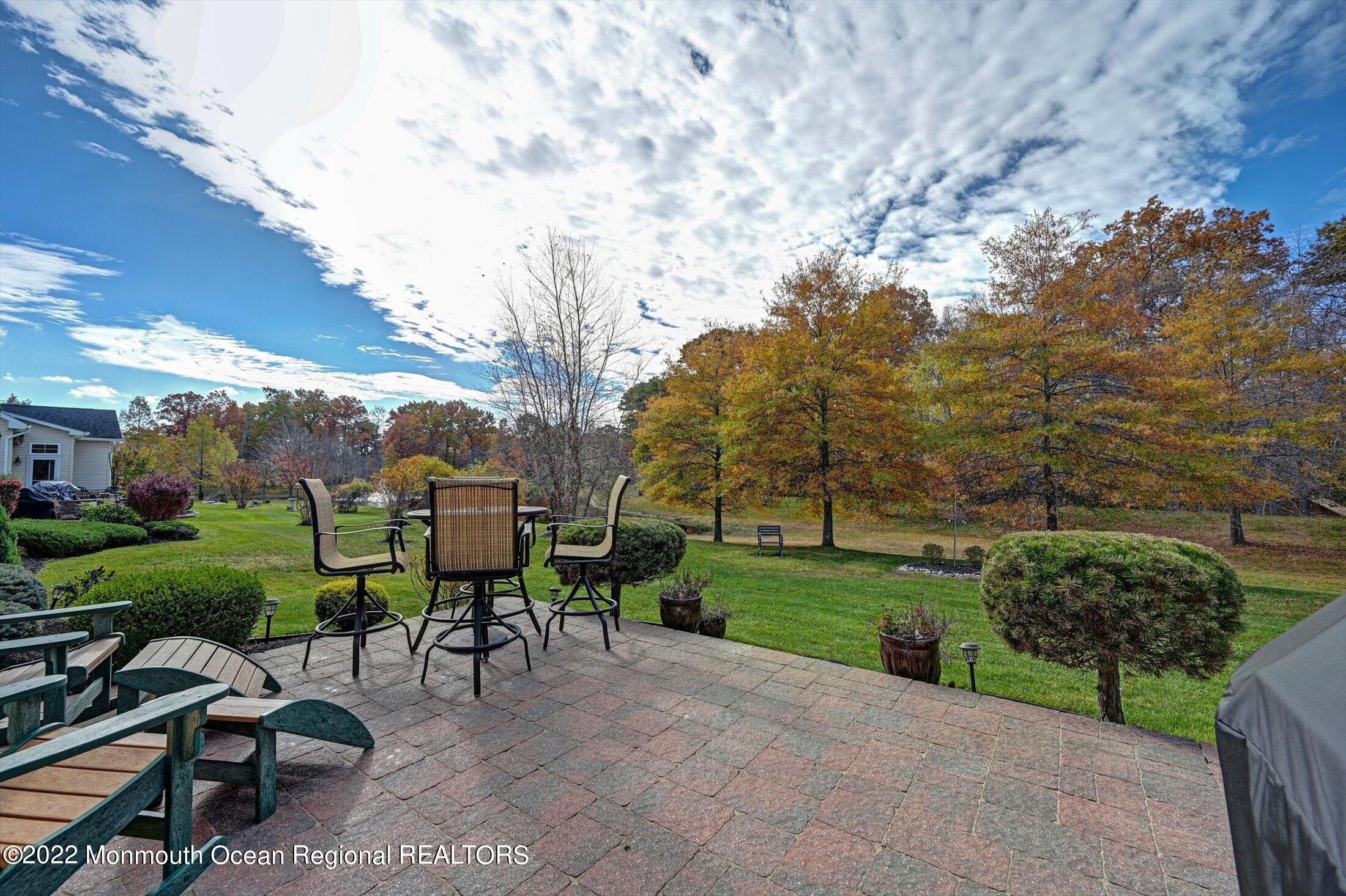 20 East Francesa Court Farmingdale, NJ 07727 - Photo 42 of 78 a view of a backyard with sitting area