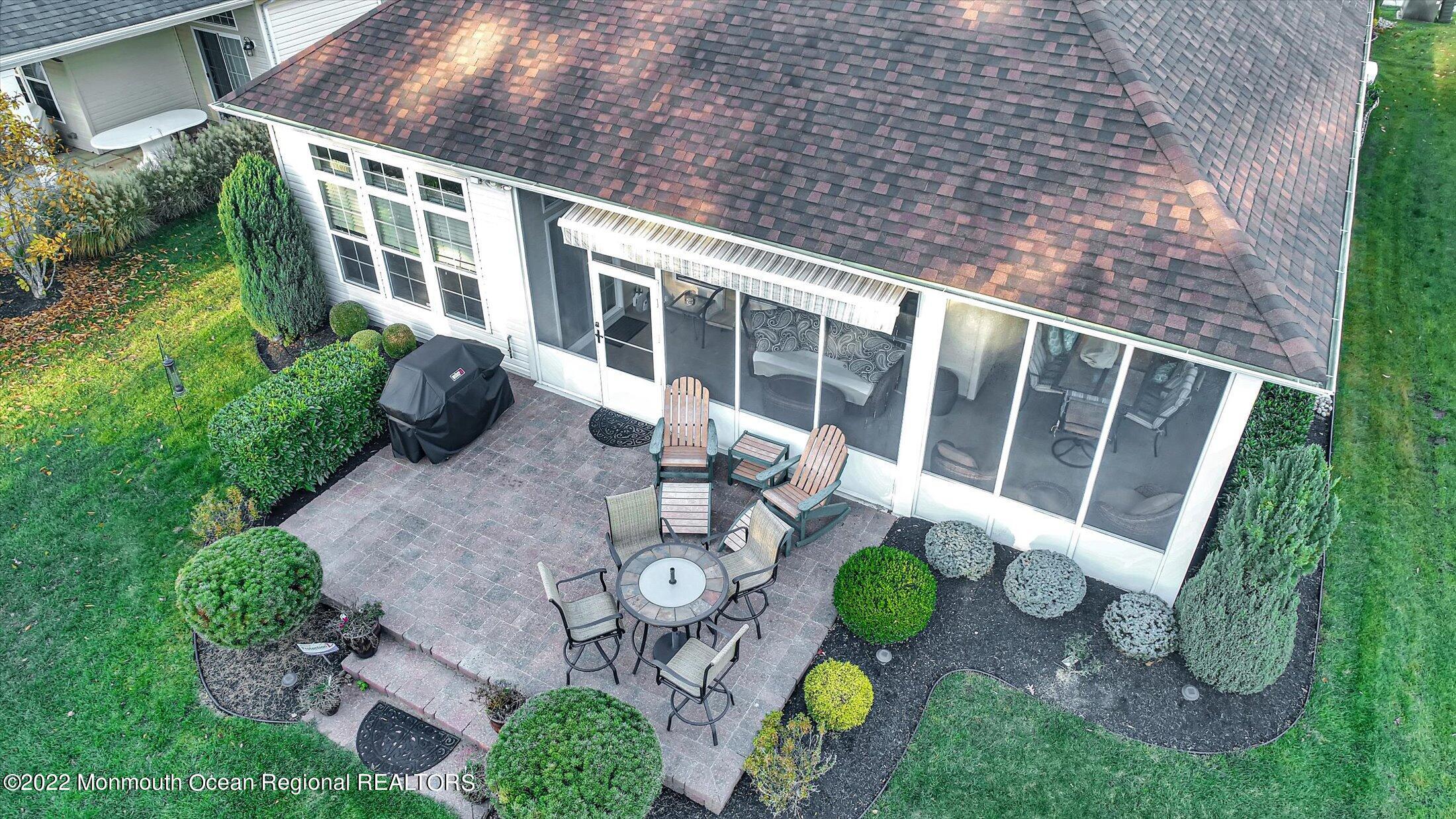 20 East Francesa Court Farmingdale, NJ 07727 - Photo 50 of 78 a view of an chairs and table in backyard