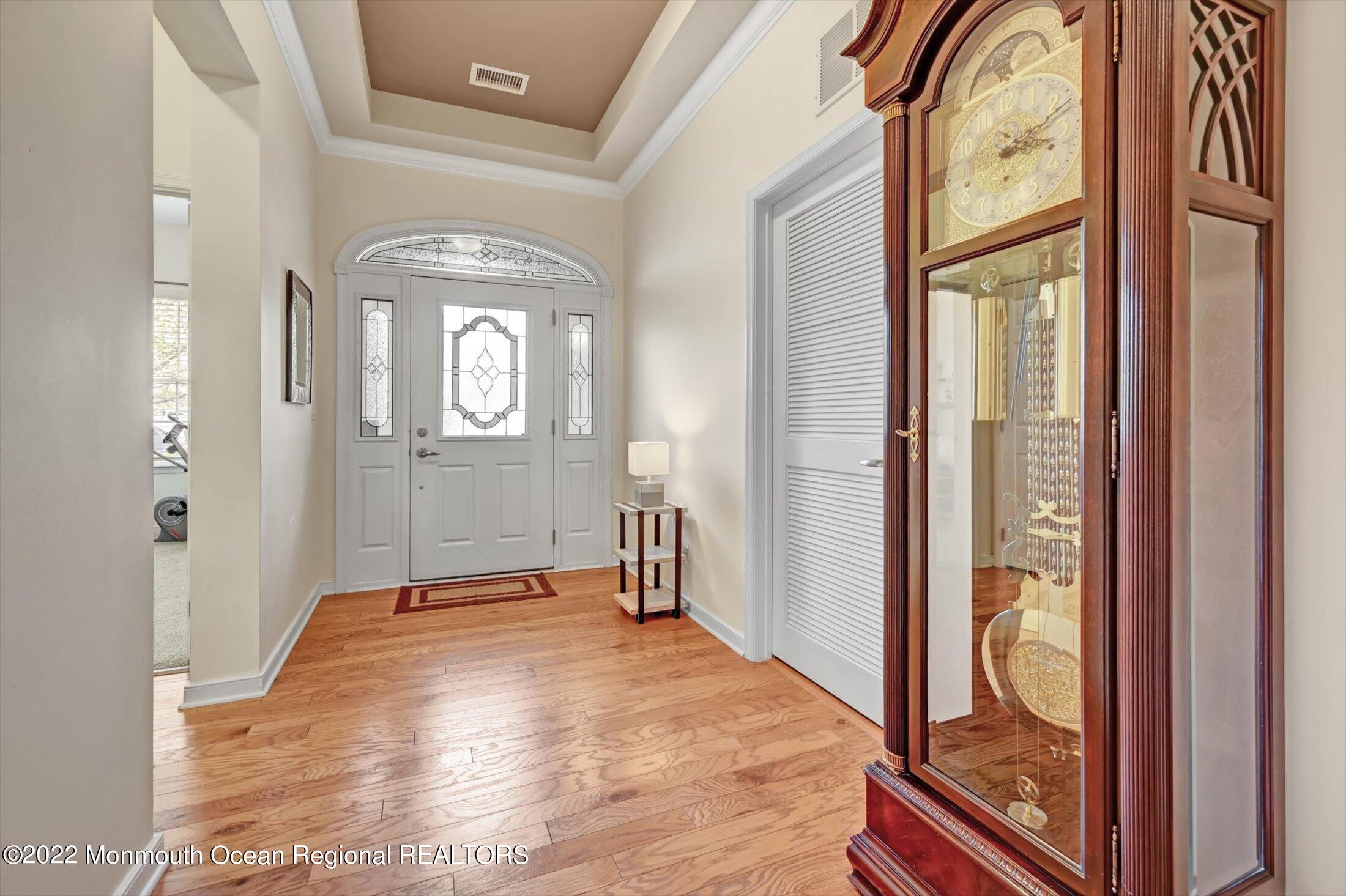 20 East Francesa Court Farmingdale, NJ 07727 - Photo 5 of 78 a view of an entryway with wooden floor and a livingroom view