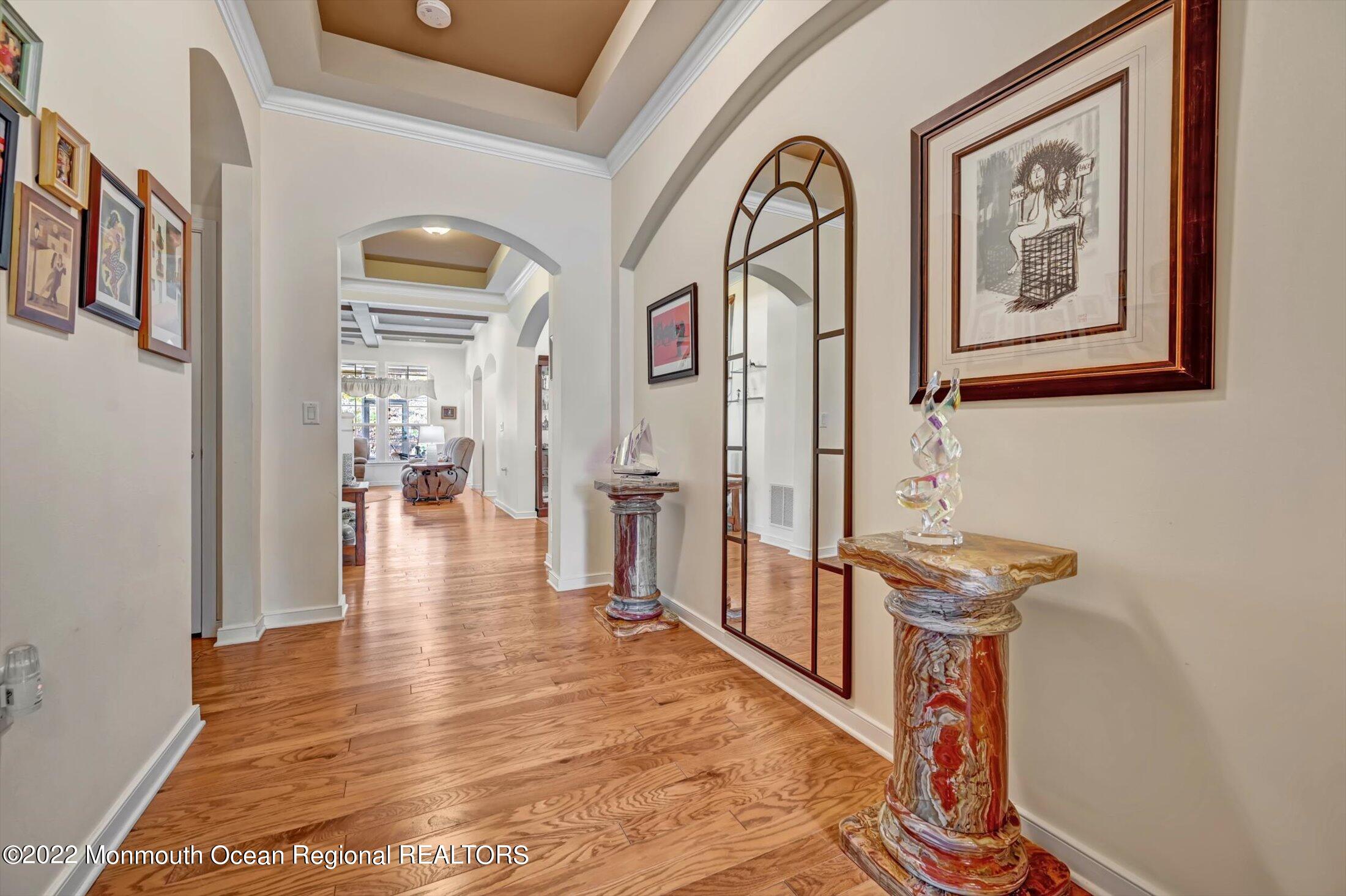 20 East Francesa Court Farmingdale, NJ 07727 - Photo 6 of 78 a view of an entryway with wooden floor