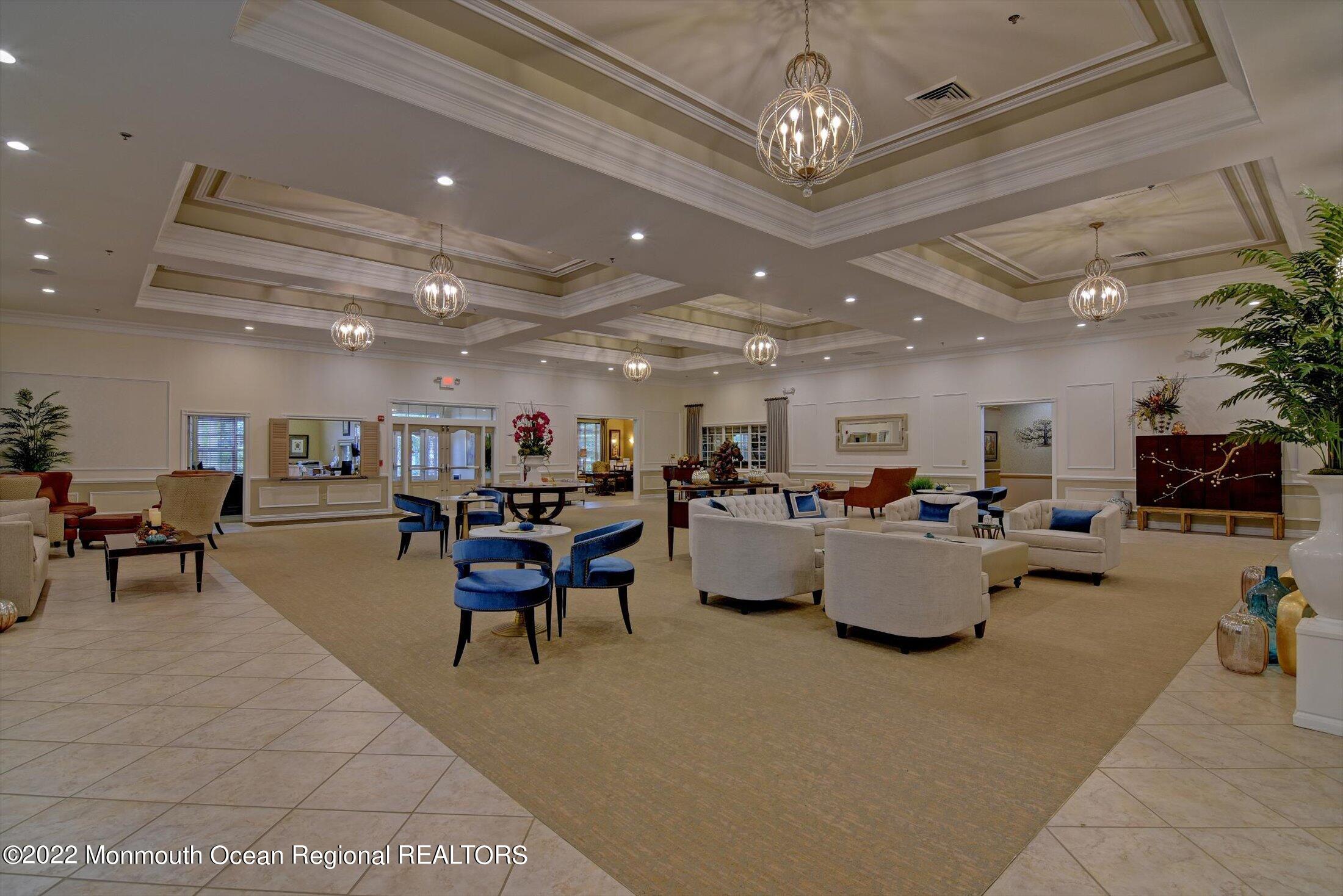 20 East Francesa Court Farmingdale, NJ 07727 - Photo 68 of 78 a living room with lots of furniture and a chandelier