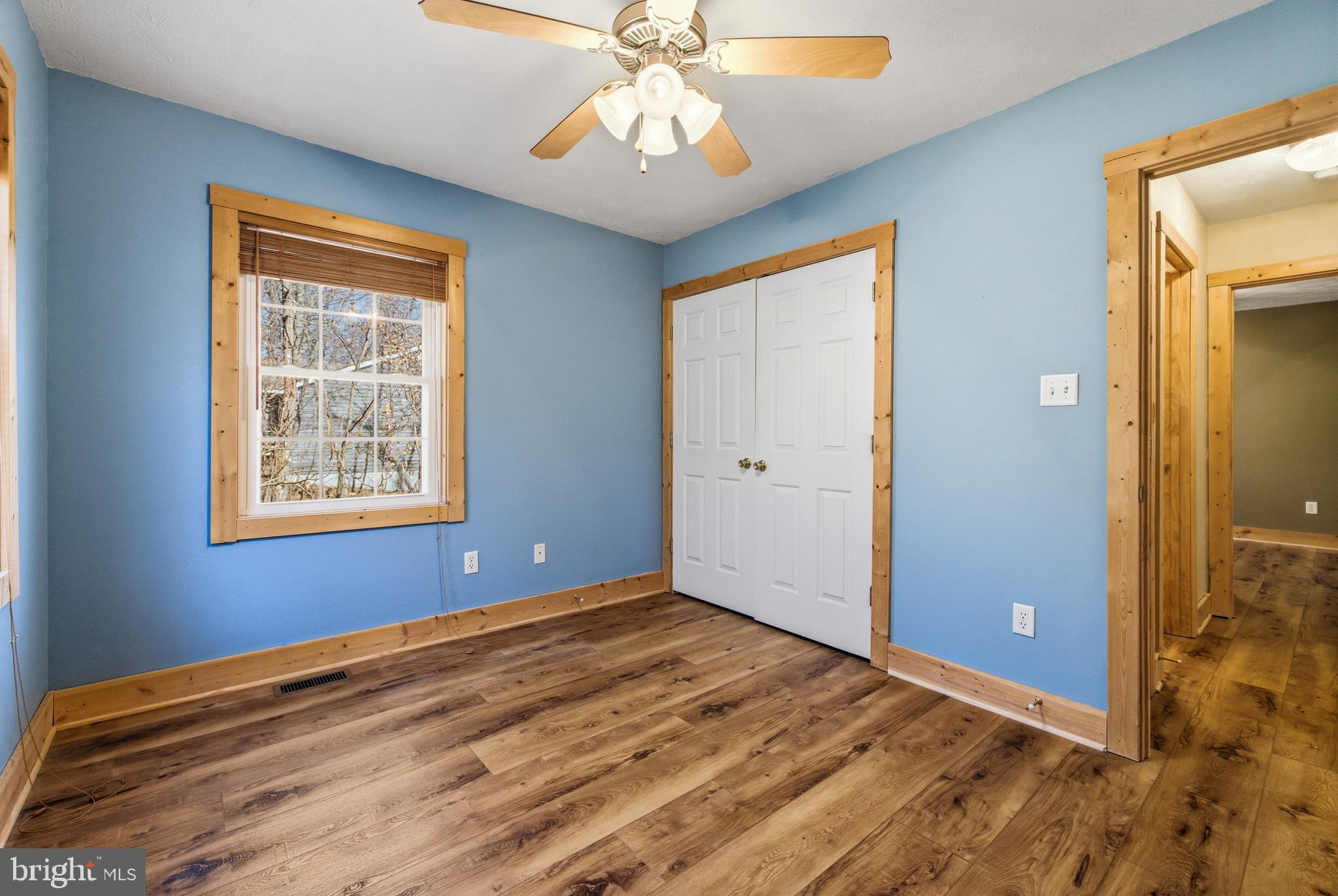 86 Maple Avenue Mount Jackson, VA 22842 - Photo 18 of 49 a view of an empty room with window and chandelier fan