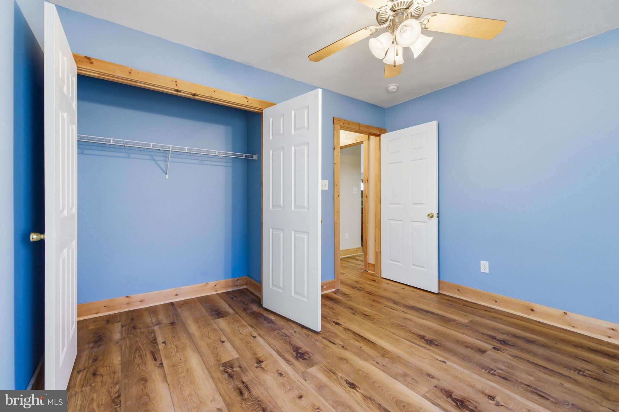 86 Maple Avenue Mount Jackson, VA 22842 - Photo 19 of 49 a view of empty room with wooden floor and fan
