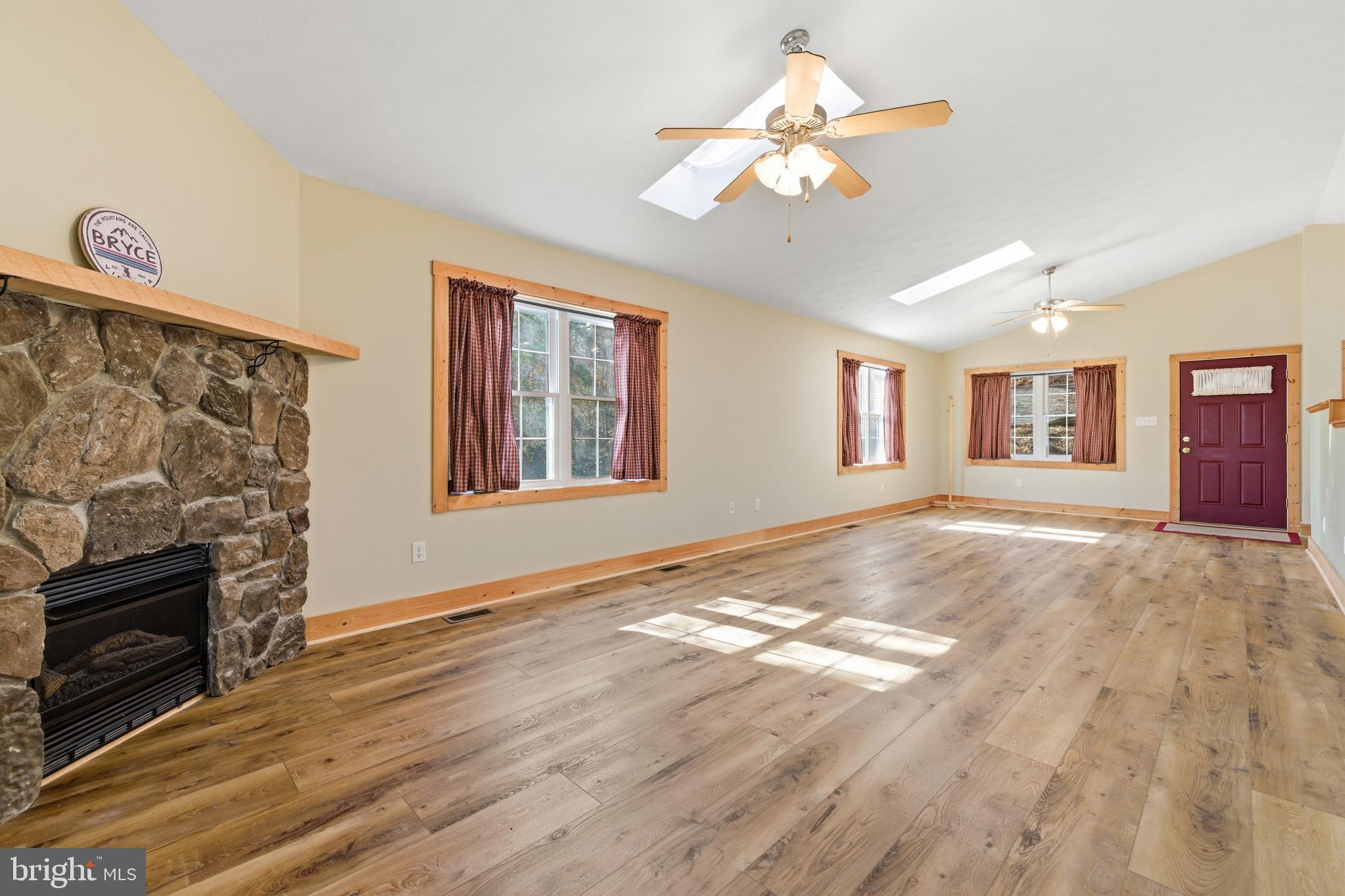 86 Maple Avenue Mount Jackson, VA 22842 - Photo 9 of 49 a view of an empty room with window and wooden floor
