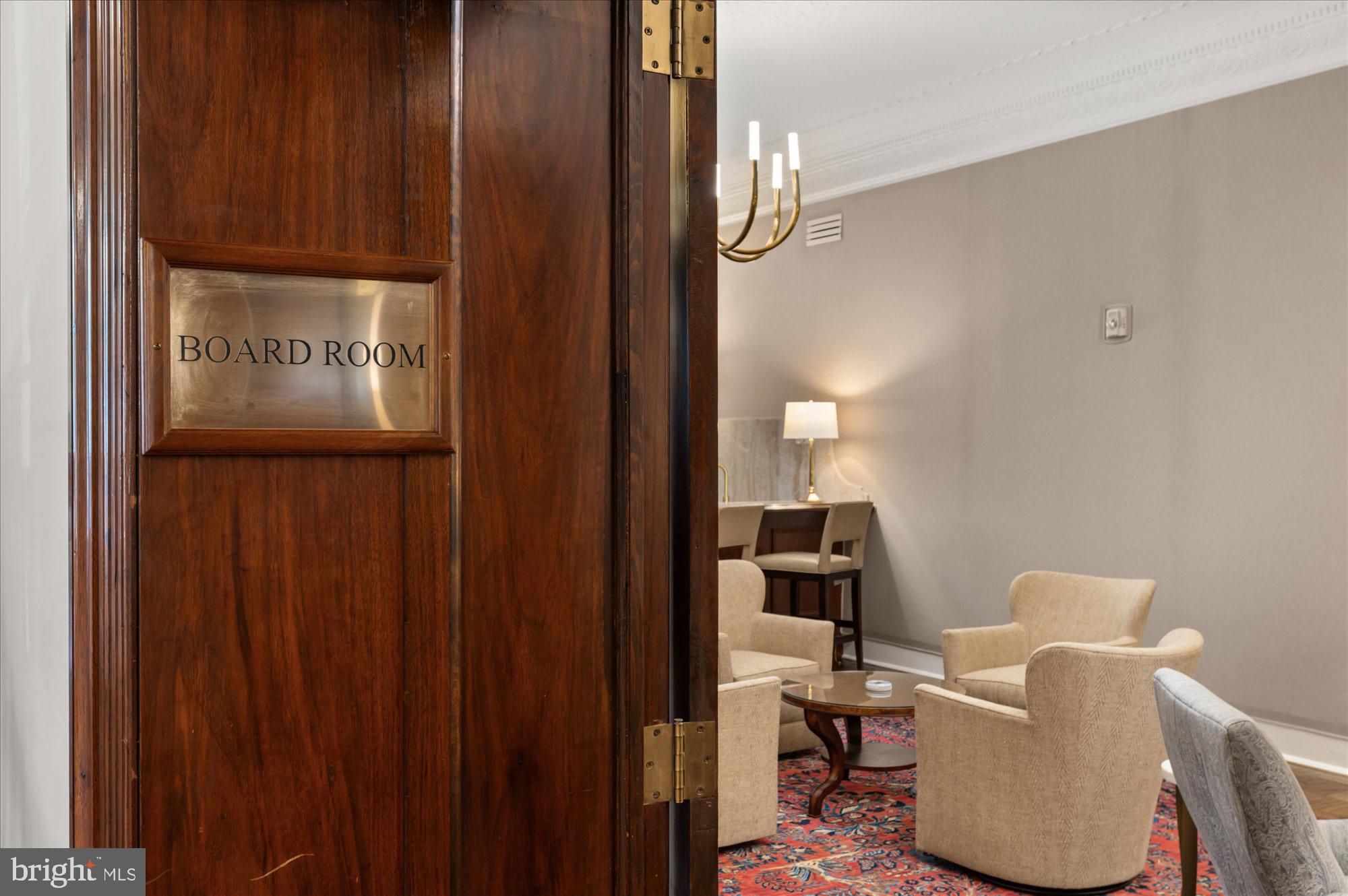 2101 Connecticut Avenue Northwest, Unit A Washington, DC 20009 - Photo 14 of 34 a view of hallway with chair and frames on wall