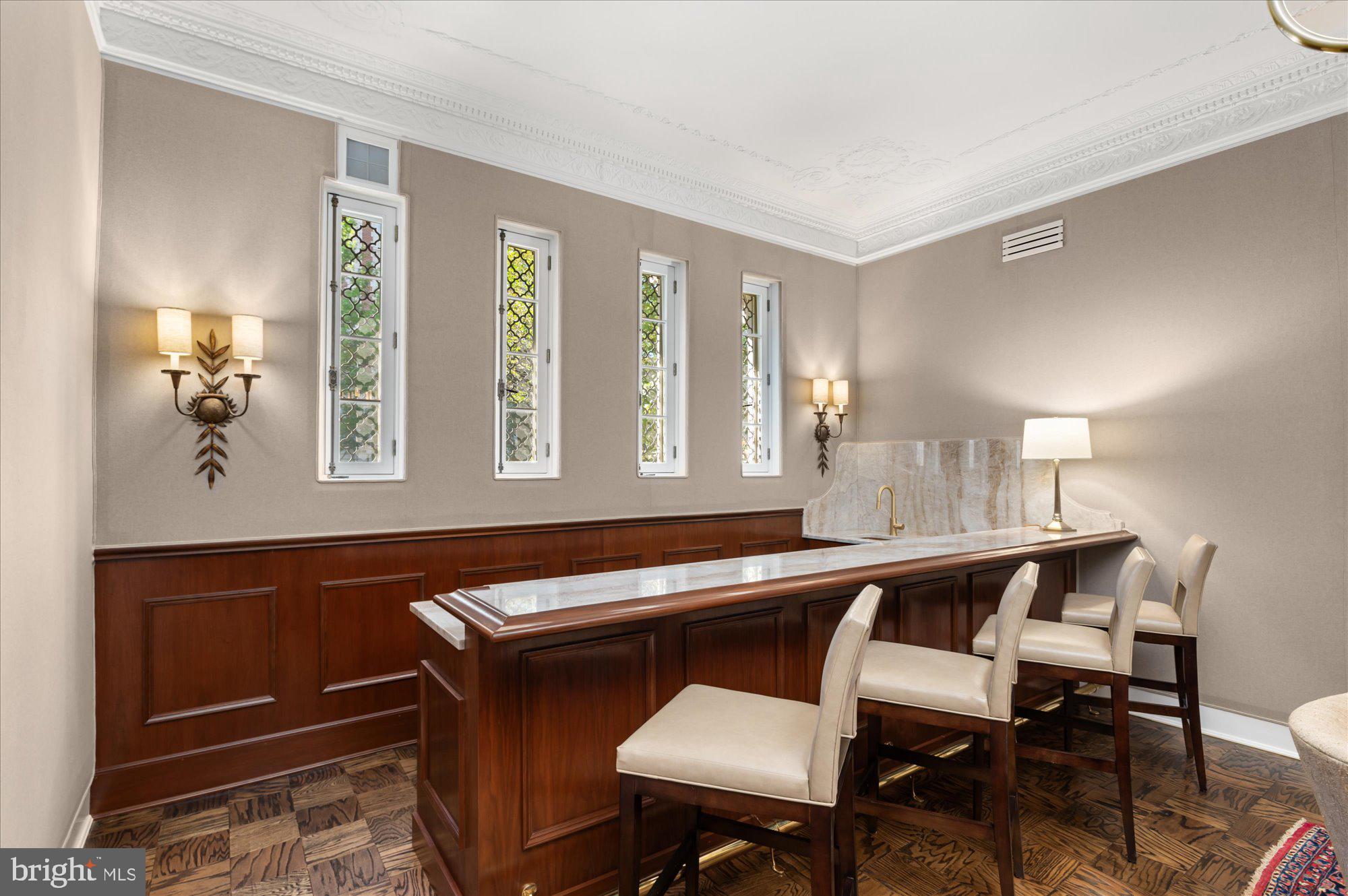 2101 Connecticut Avenue Northwest, Unit A Washington, DC 20009 - Photo 16 of 34 a room with a table chairs and wooden floor