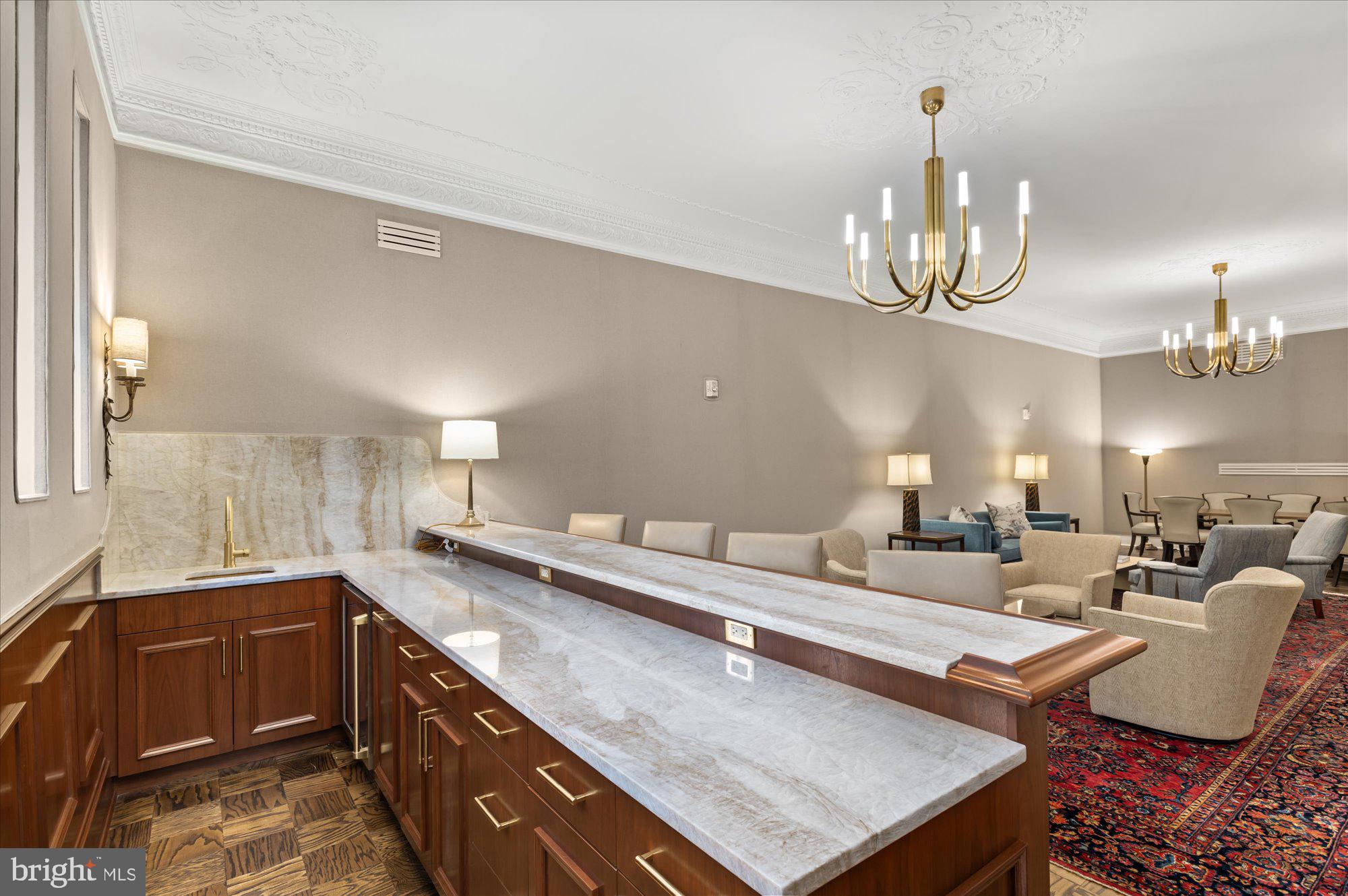 2101 Connecticut Avenue Northwest, Unit A Washington, DC 20009 - Photo 17 of 34 a large kitchen with a table and chairs in it