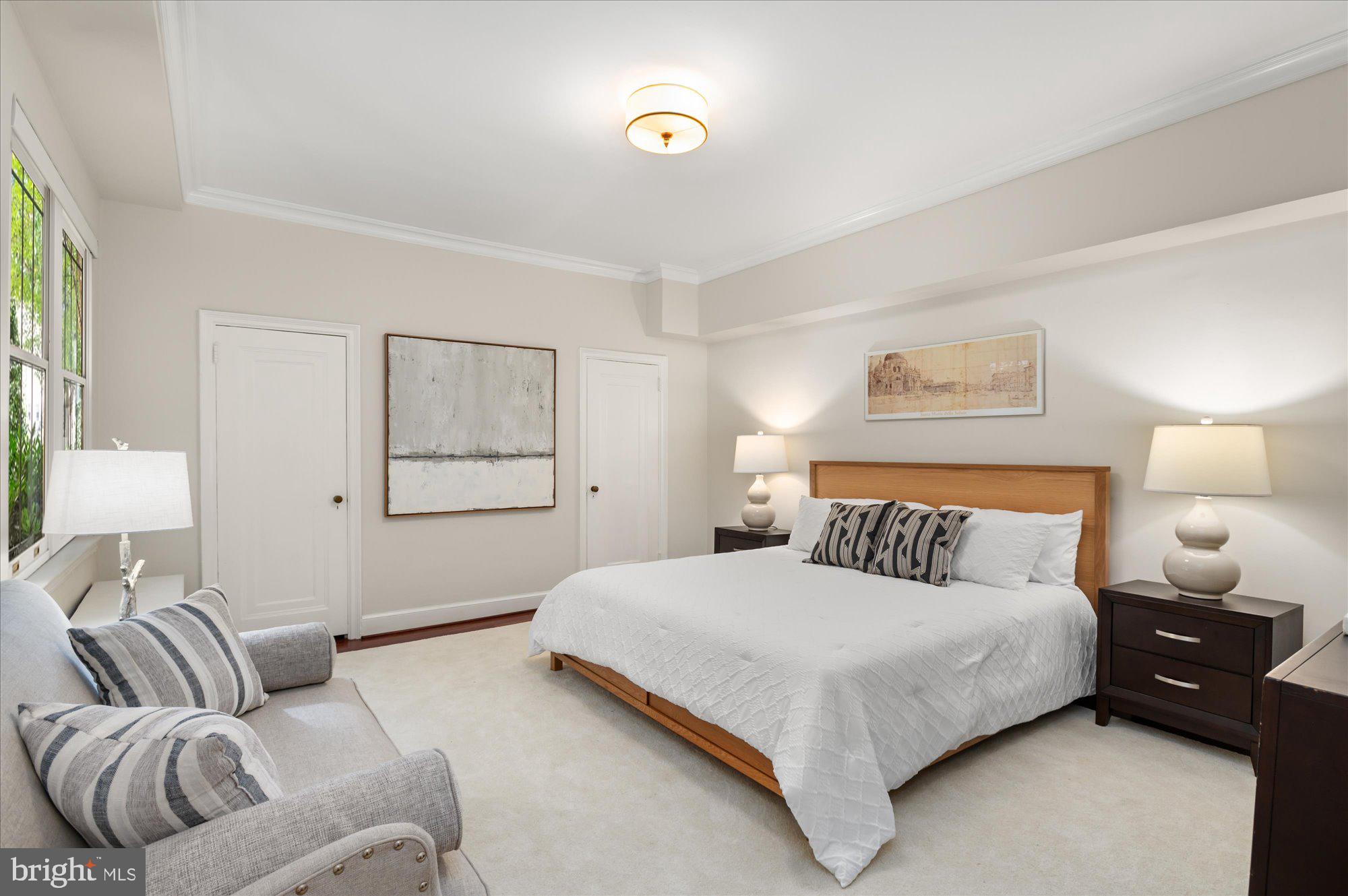 2101 Connecticut Avenue Northwest, Unit A Washington, DC 20009 - Photo 7 of 34 a bedroom with a bed and a couch