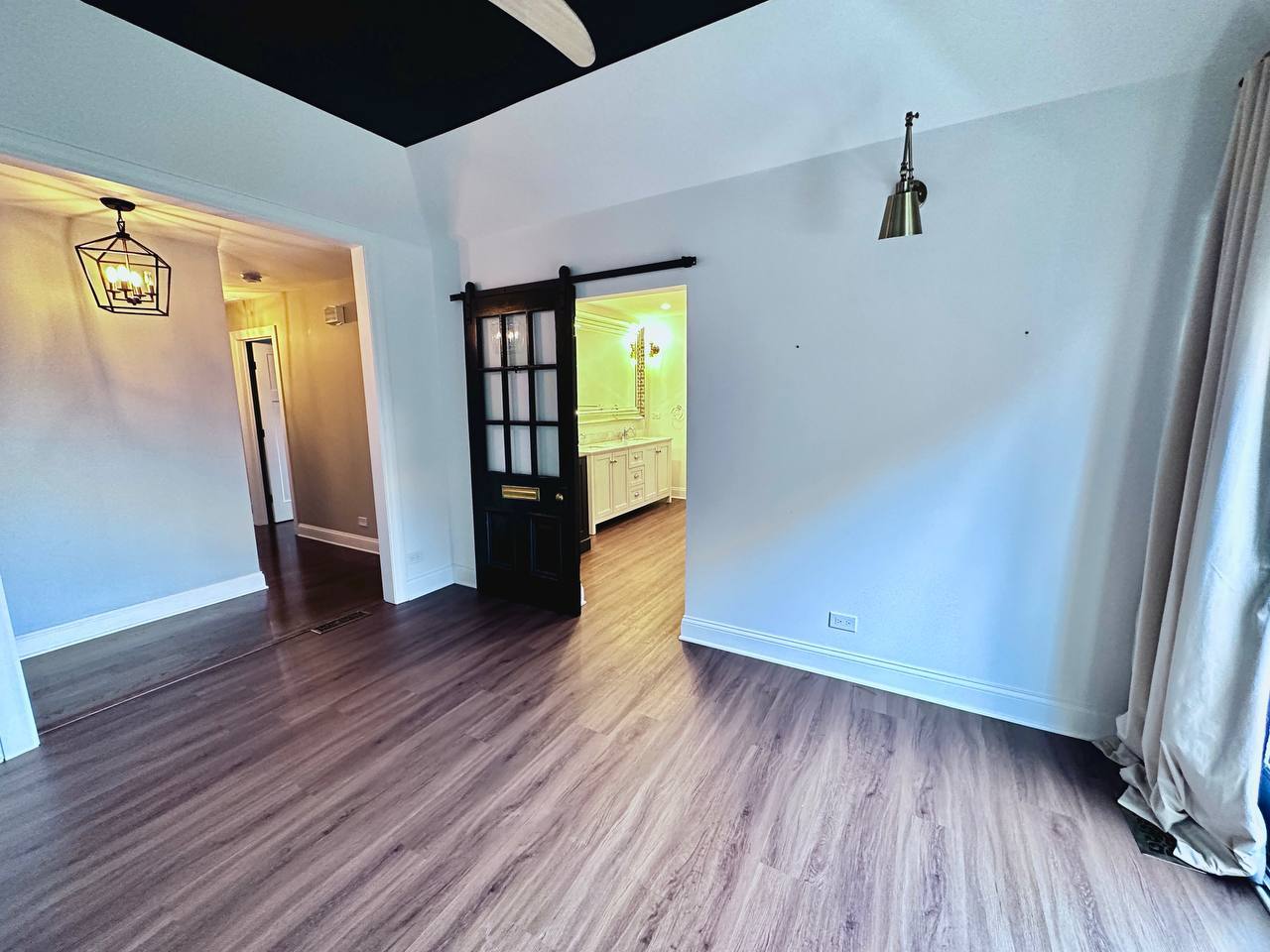 6140 Ruby Street Rosemont, IL 60018 - Photo 14 of 35 a view of an empty room with wooden floor and a window