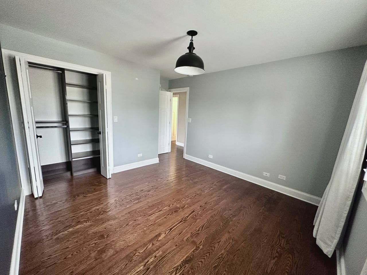 6140 Ruby Street Rosemont, IL 60018 - Photo 19 of 35 an empty room with wooden floor closet and windows