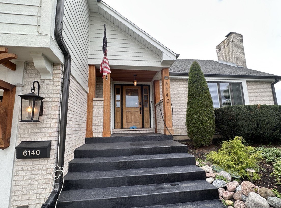 6140 Ruby Street Rosemont, IL 60018 - Photo 2 of 35 a view of a house with large windows and flower plants