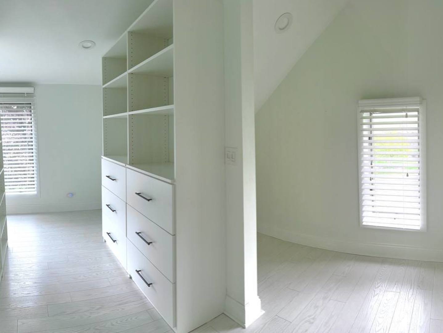 6140 Ruby Street Rosemont, IL 60018 - Photo 23 of 35 an empty room with windows and cabinet