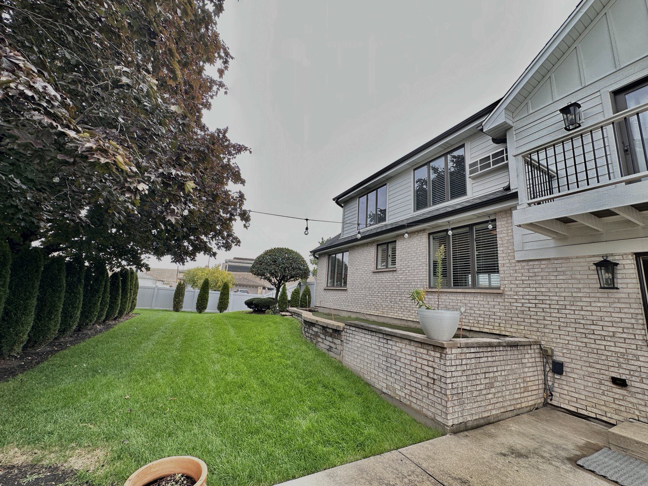 6140 Ruby Street Rosemont, IL 60018 - Photo 30 of 35 a front view of a house with garden