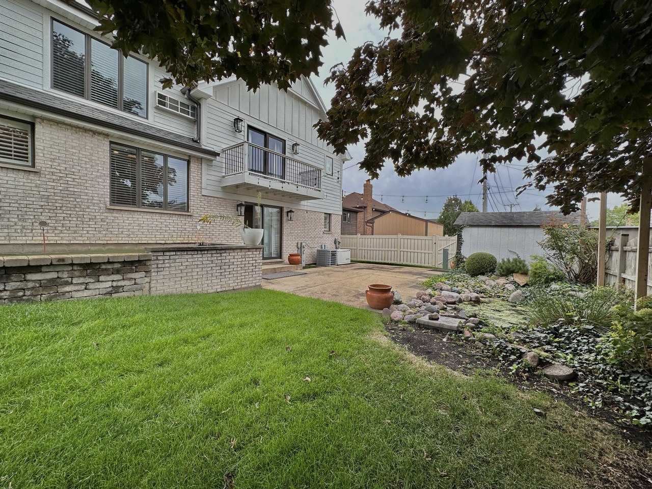 6140 Ruby Street Rosemont, IL 60018 - Photo 31 of 35 a front view of a house with a garden