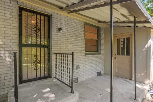 a view of a porch with a door