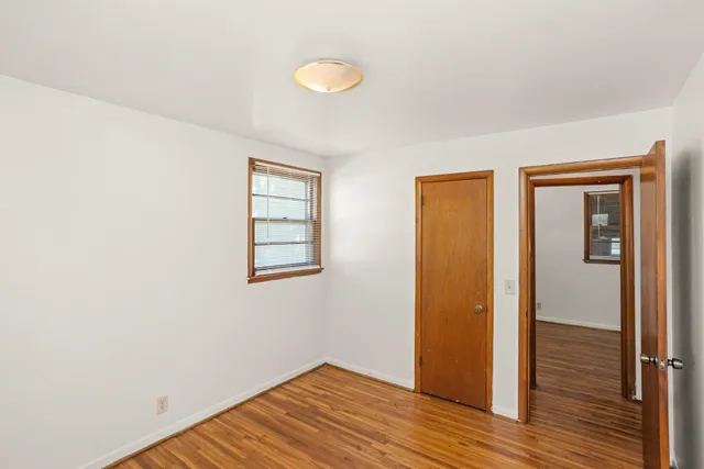 a view of a room with wooden floor and small space