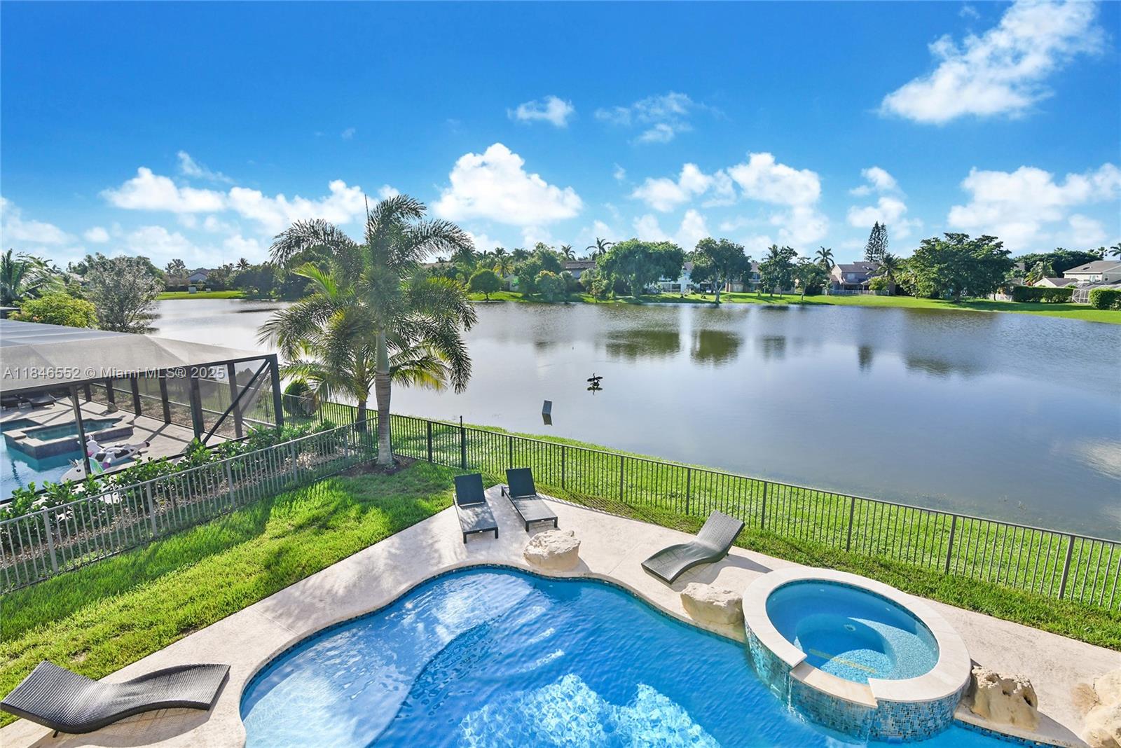 12137 Boca Reserve Lane Boca Raton, FL 33428 - Photo 13 of 35 a view of a lake with couches chairs and a table