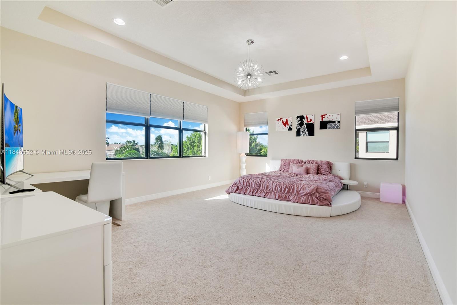 12137 Boca Reserve Lane Boca Raton, FL 33428 - Photo 15 of 35 a living room with a bed furniture and a flat screen tv