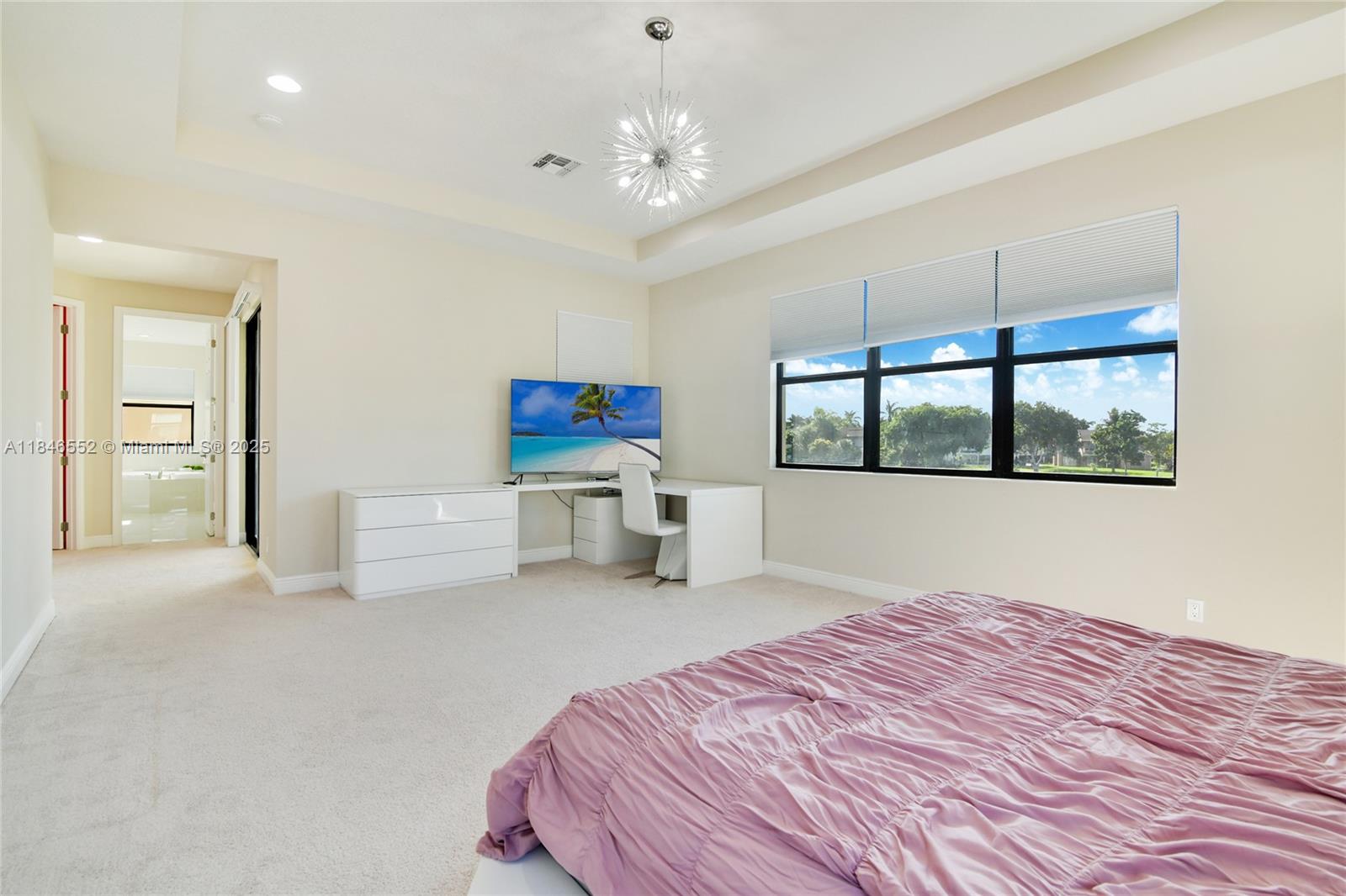 12137 Boca Reserve Lane Boca Raton, FL 33428 - Photo 16 of 35 a bedroom with a bed and a large window