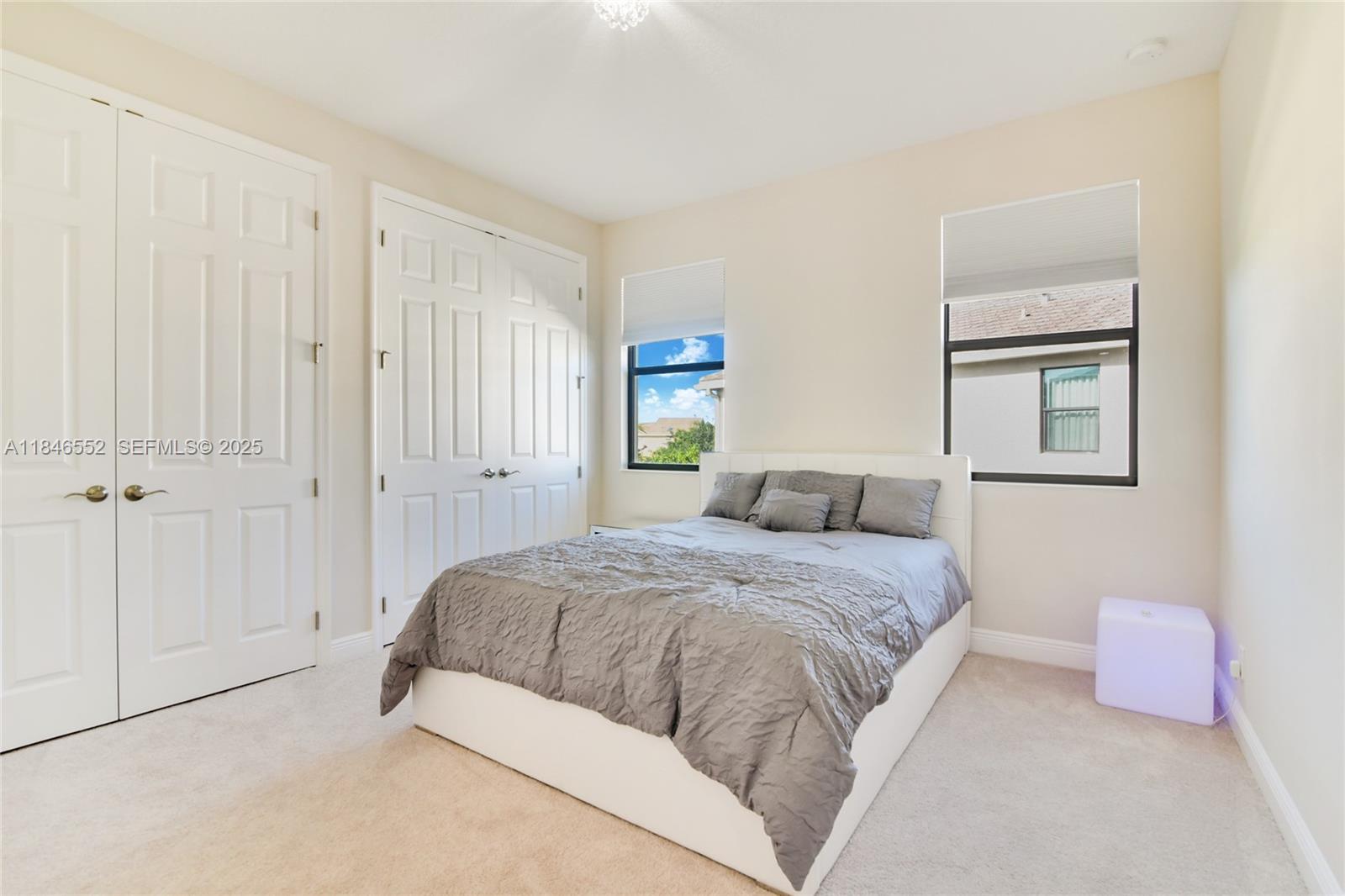 12137 Boca Reserve Lane Boca Raton, FL 33428 - Photo 22 of 35 a bedroom with a bed and a painting