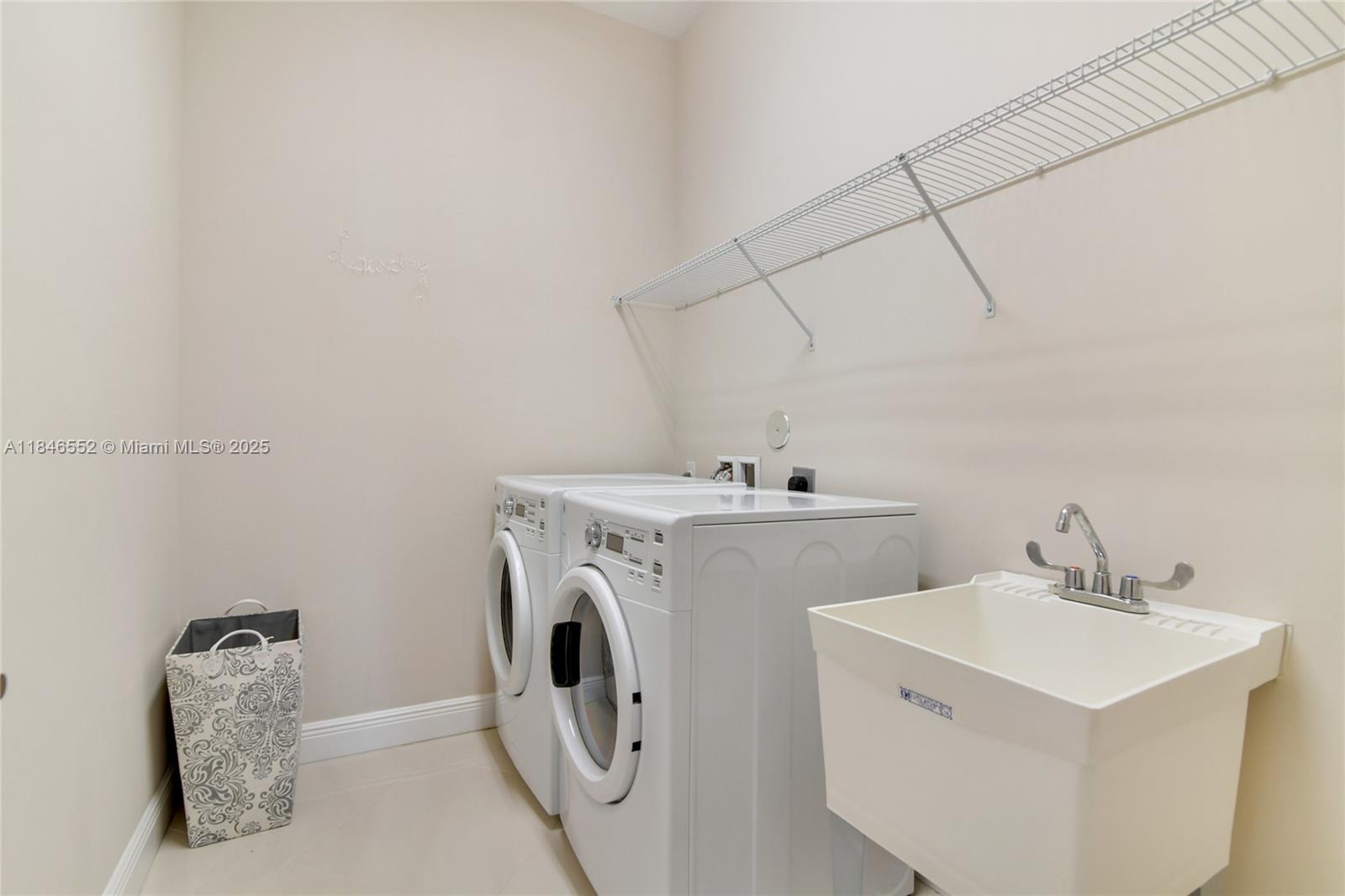 12137 Boca Reserve Lane Boca Raton, FL 33428 - Photo 28 of 35 a utility room with dryer and washer