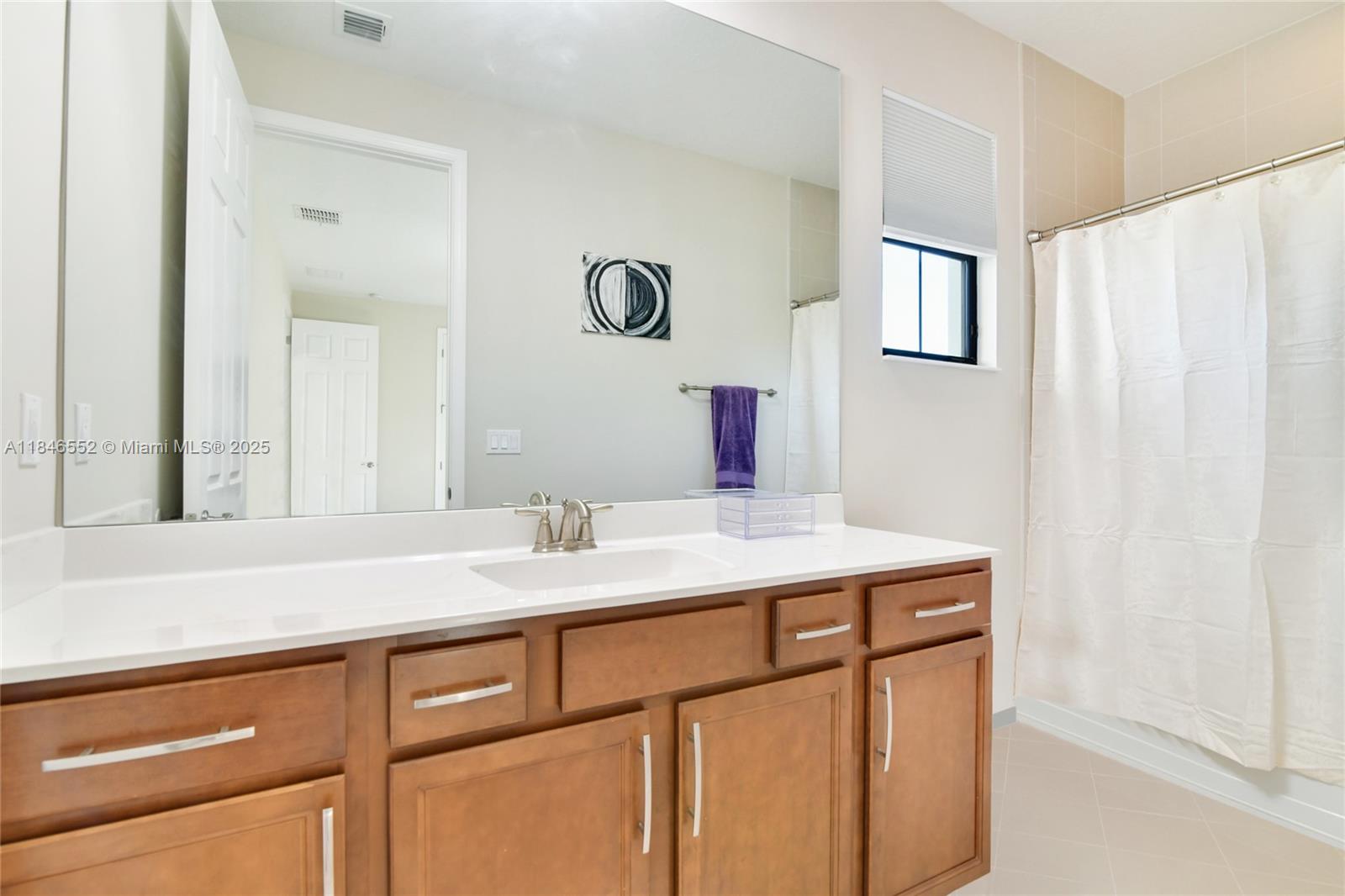 12137 Boca Reserve Lane Boca Raton, FL 33428 - Photo 30 of 35 a utility room with cabinets washer and dryer