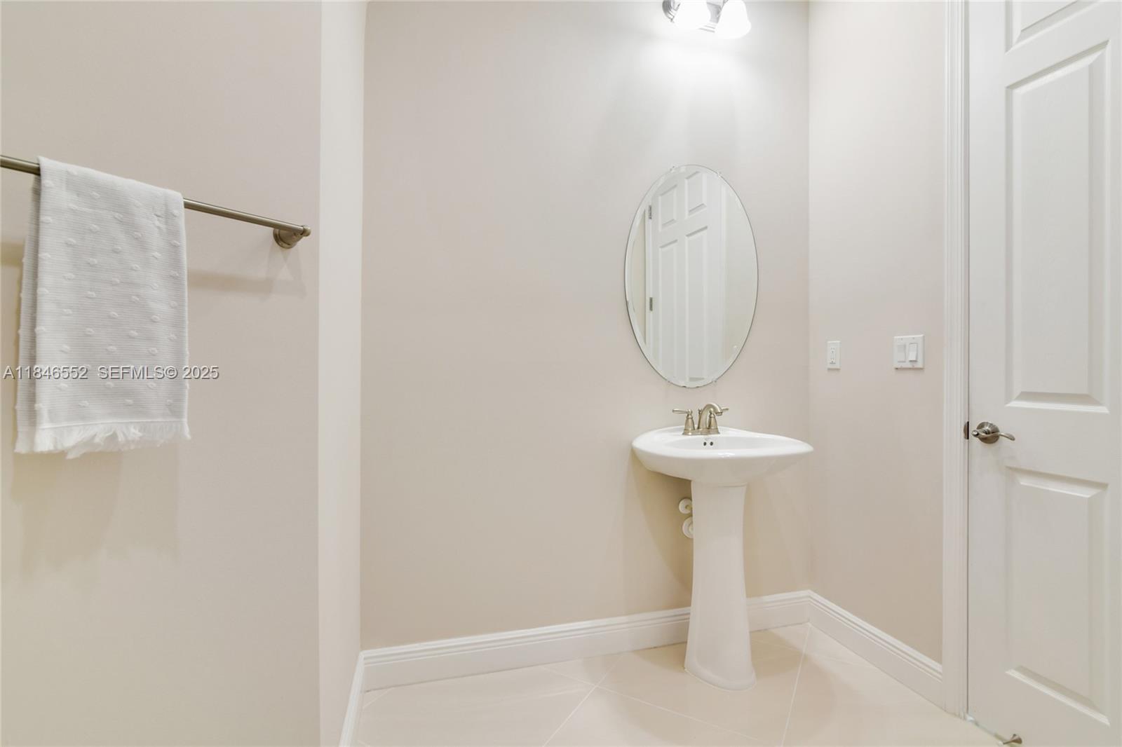 12137 Boca Reserve Lane Boca Raton, FL 33428 - Photo 32 of 35 a bathroom with a sink a mirror and a shower
