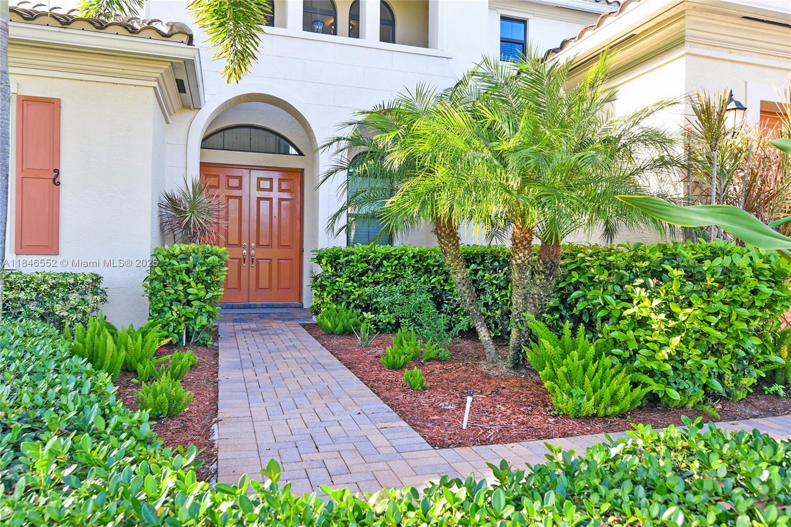 12137 Boca Reserve Lane Boca Raton, FL 33428 - Photo 34 of 35 a front view of a house with garden