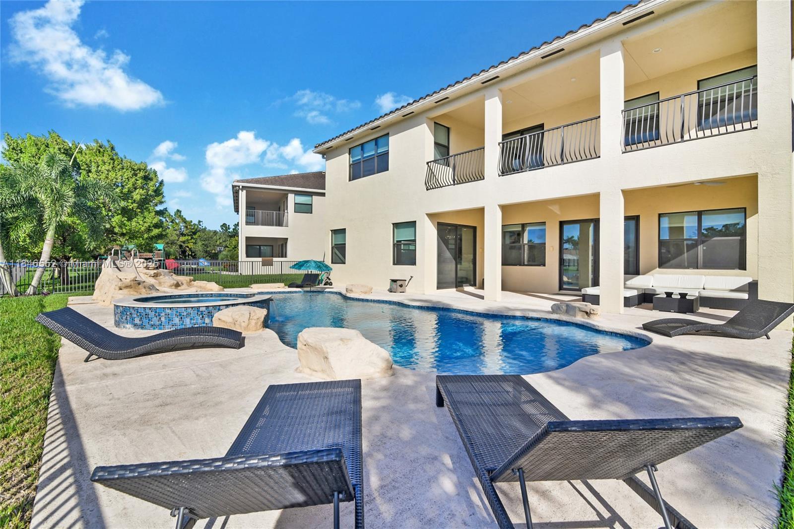 12137 Boca Reserve Lane Boca Raton, FL 33428 - Photo 5 of 35 a view of a patio with dining table and chairs with wooden floor