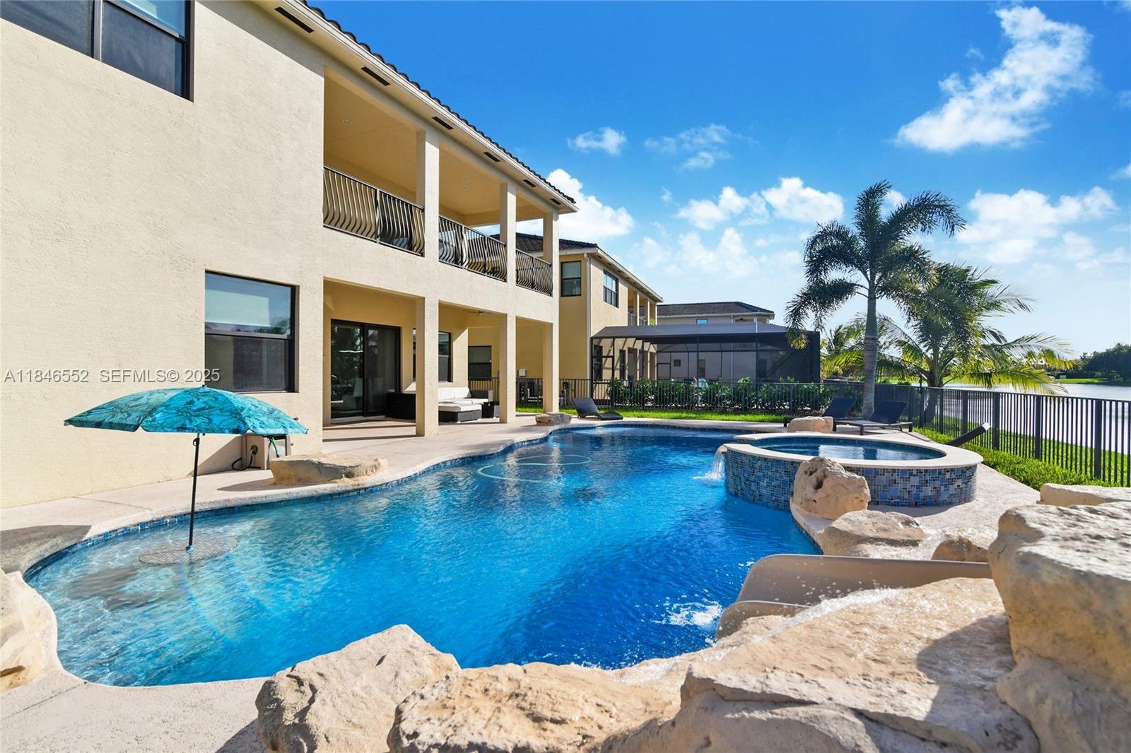 12137 Boca Reserve Lane Boca Raton, FL 33428 - Photo 6 of 35 a view of a swimming pool with lounge chairs