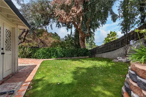a backyard of a house with lots of green space