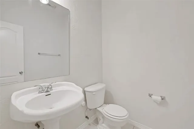 a bathroom with a sink and a toilet