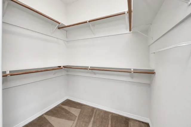 a view of an empty walk in closet