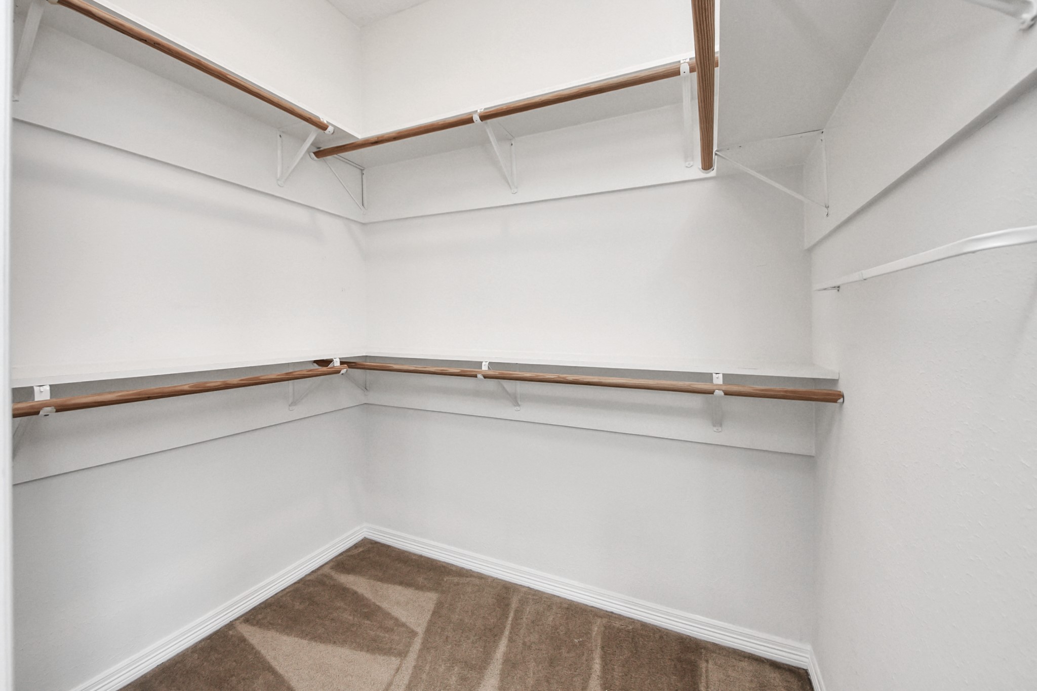 21940 Rayford Road, Unit B Humble, TX 77338 - Photo 22 of 38 a view of an empty walk in closet