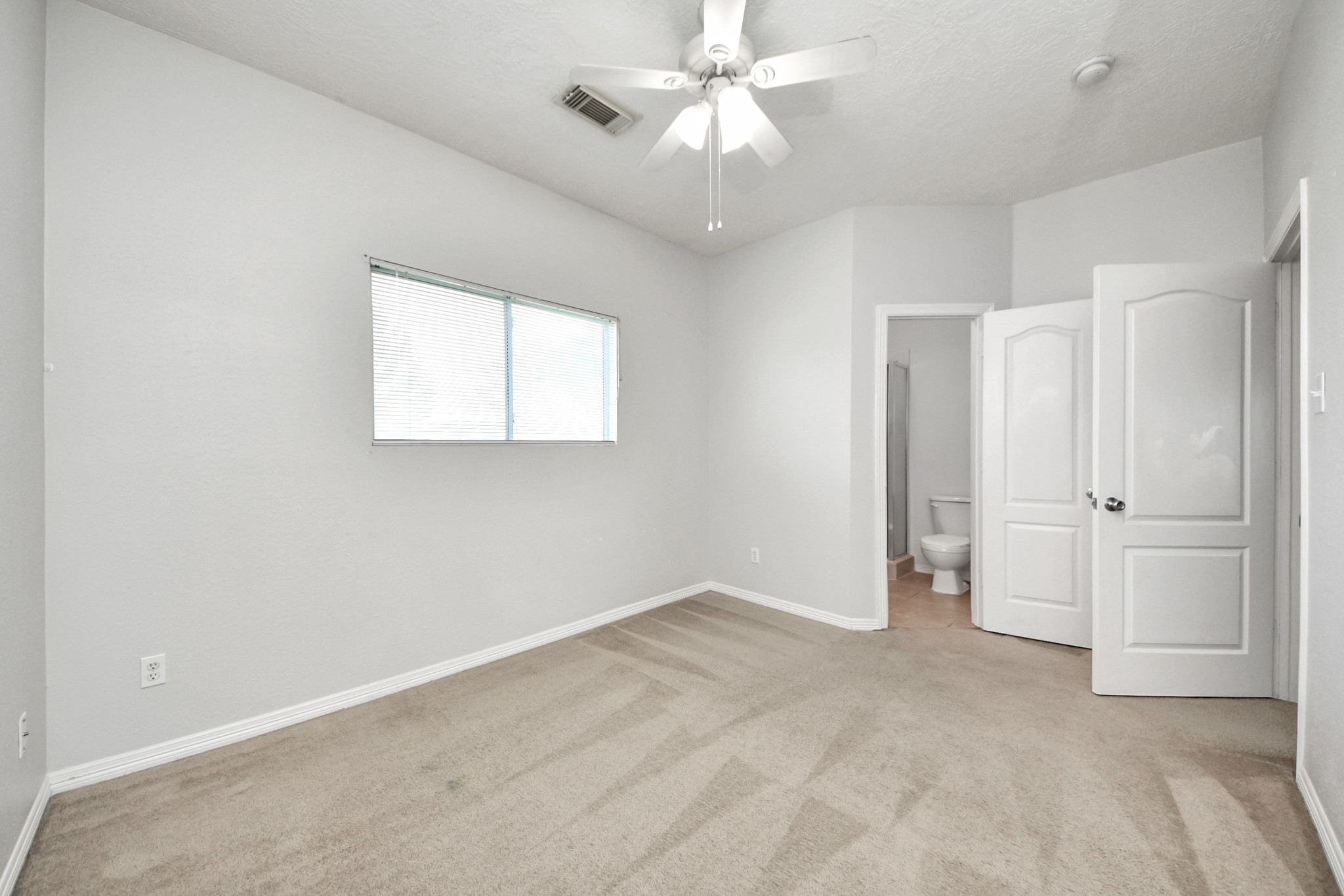 21940 Rayford Road, Unit B Humble, TX 77338 - Photo 25 of 38 a view of an empty room with a window