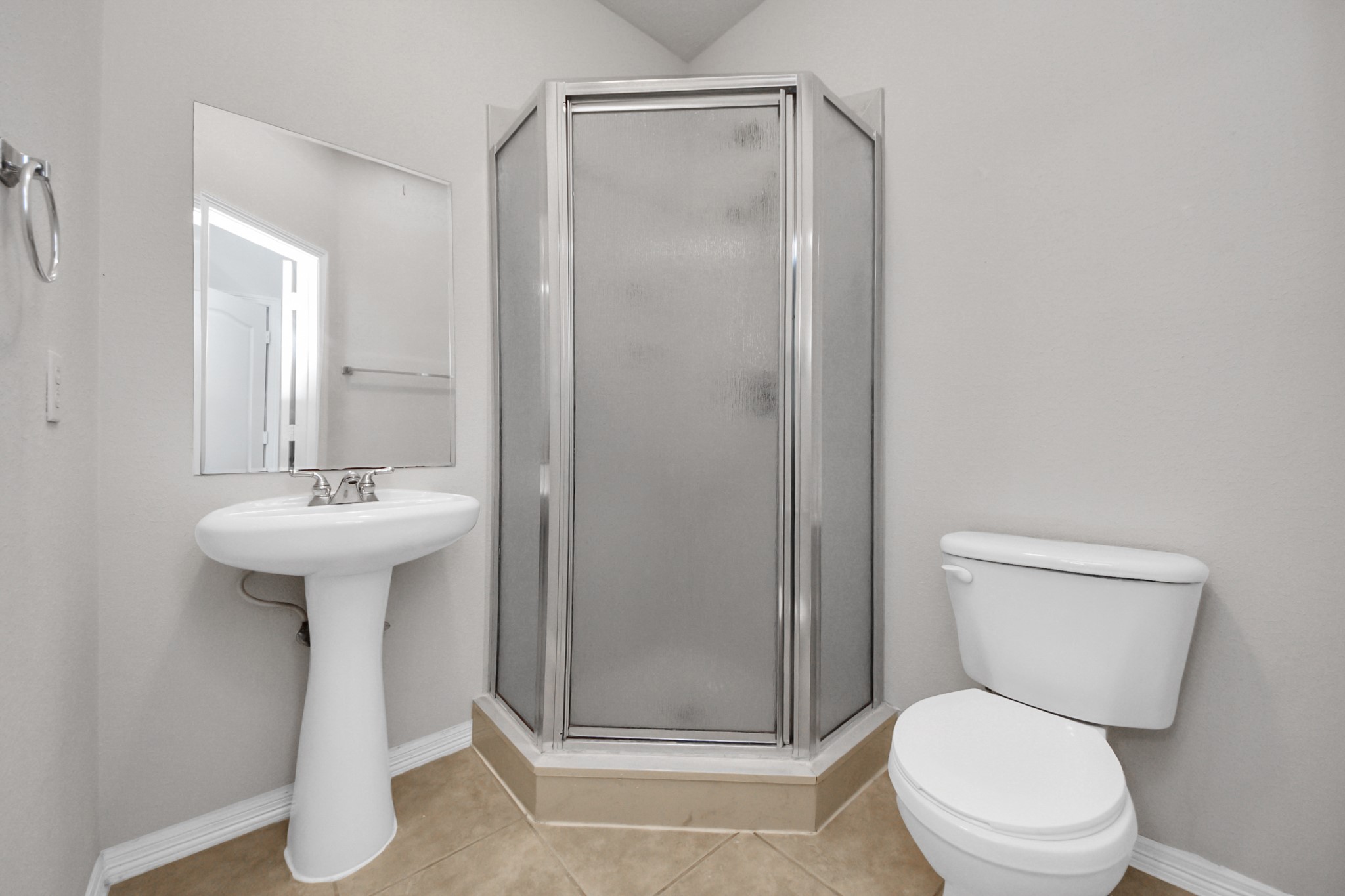 21940 Rayford Road, Unit B Humble, TX 77338 - Photo 27 of 38 a bathroom with a sink a toilet a mirror and shower