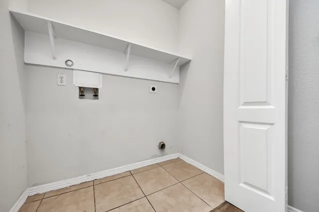 a view of a backyard with wooden fence