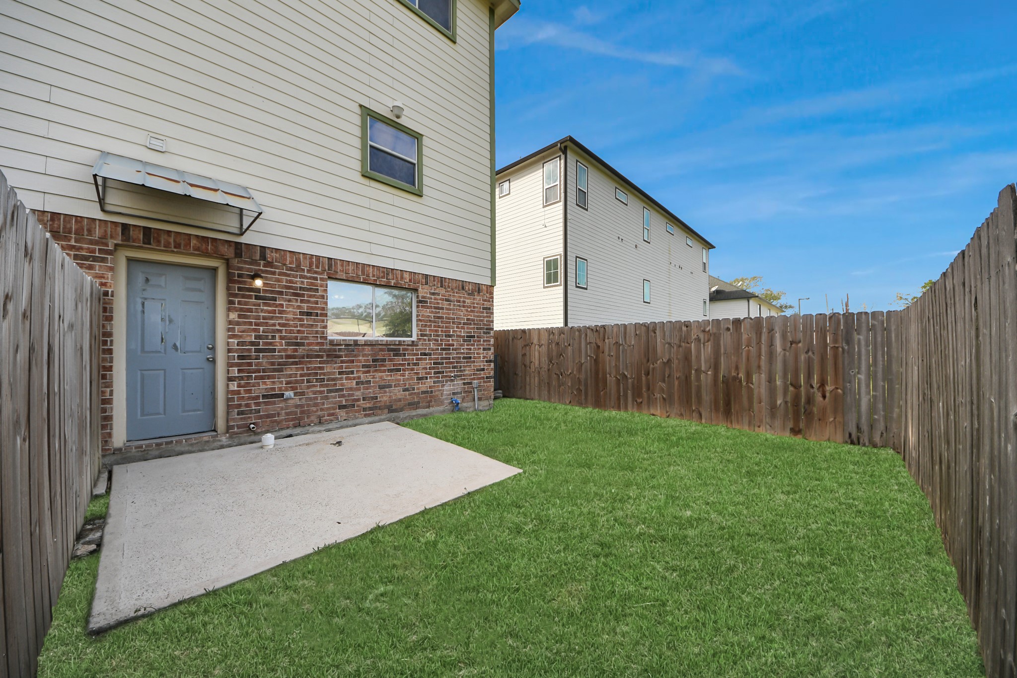 21940 Rayford Road, Unit B Humble, TX 77338 - Photo 34 of 38 a view of a backyard with wooden fence
