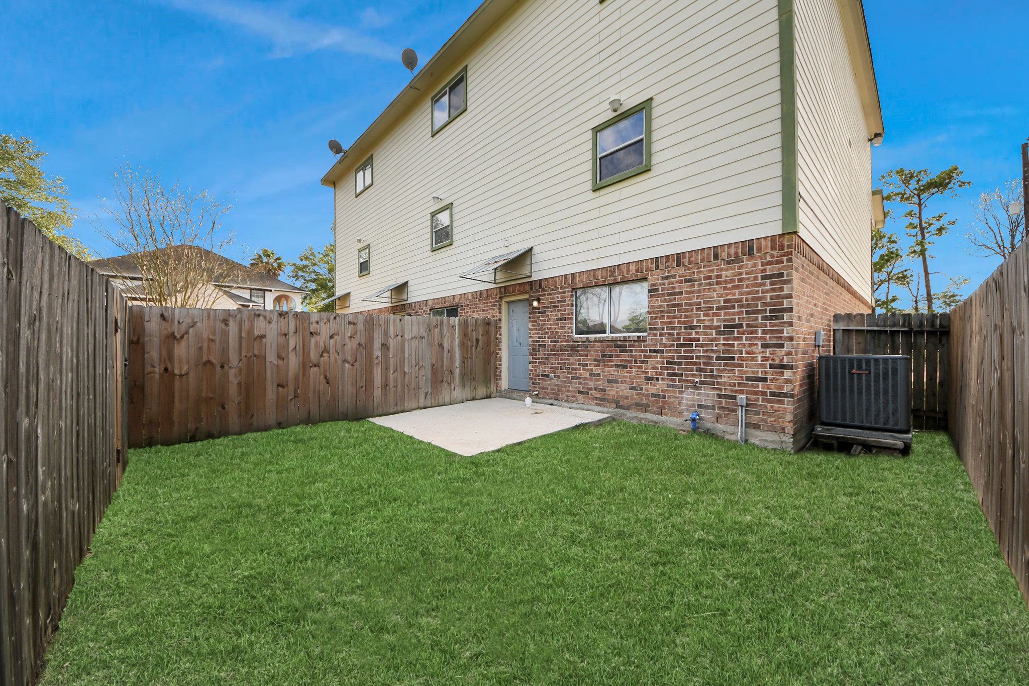 21940 Rayford Road, Unit B Humble, TX 77338 - Photo 35 of 38 a view of a backyard with wooden fence