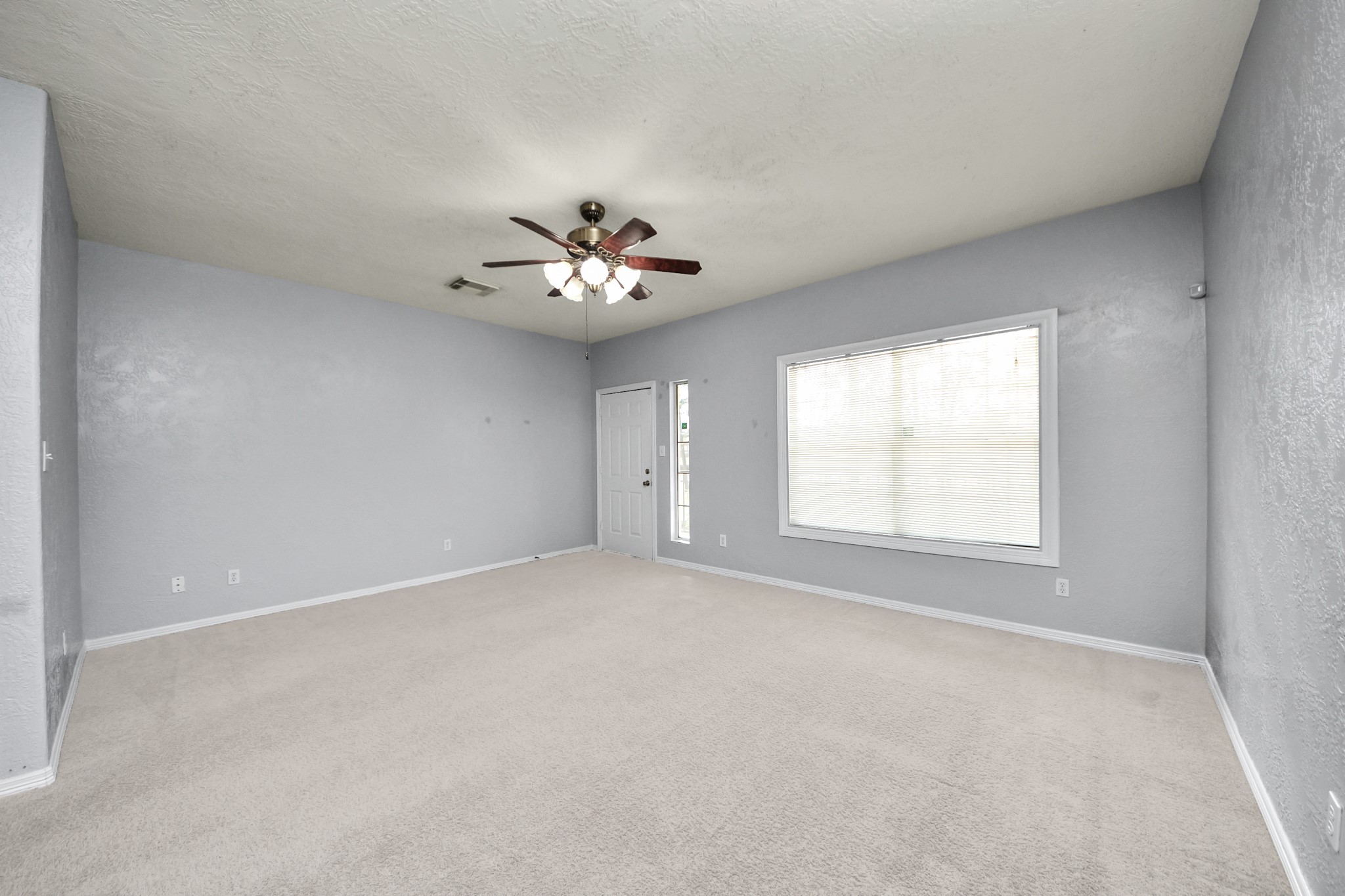 21940 Rayford Road, Unit B Humble, TX 77338 - Photo 4 of 38 a view of an empty room with a window