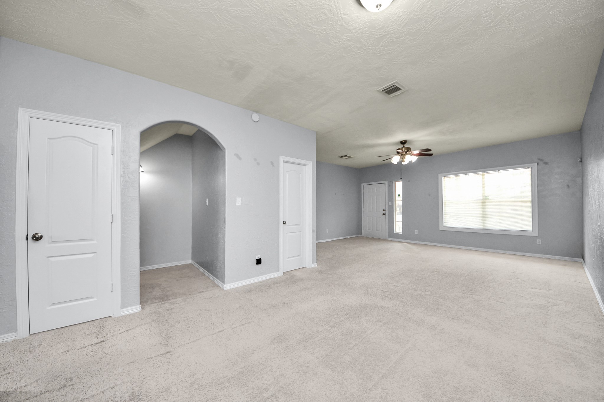 21940 Rayford Road, Unit B Humble, TX 77338 - Photo 6 of 38 an empty room with windows and closet