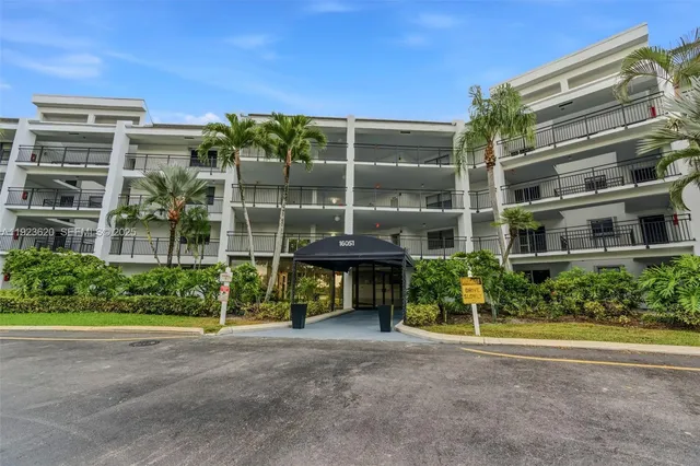 a view of a building with a yard