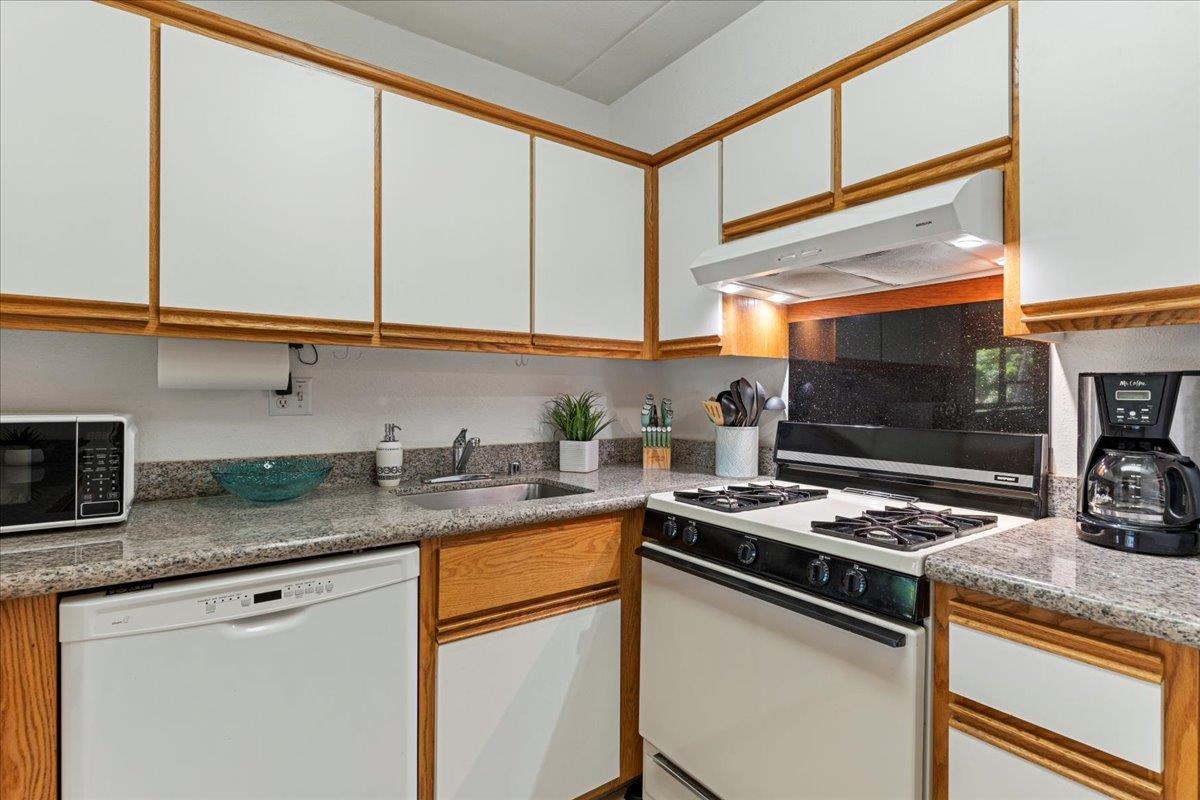 2531 South Kihei Road, Unit C317 Kihei, HI 96753 - Photo 15 of 32 a kitchen with stainless steel appliances granite countertop a sink stove and cabinets