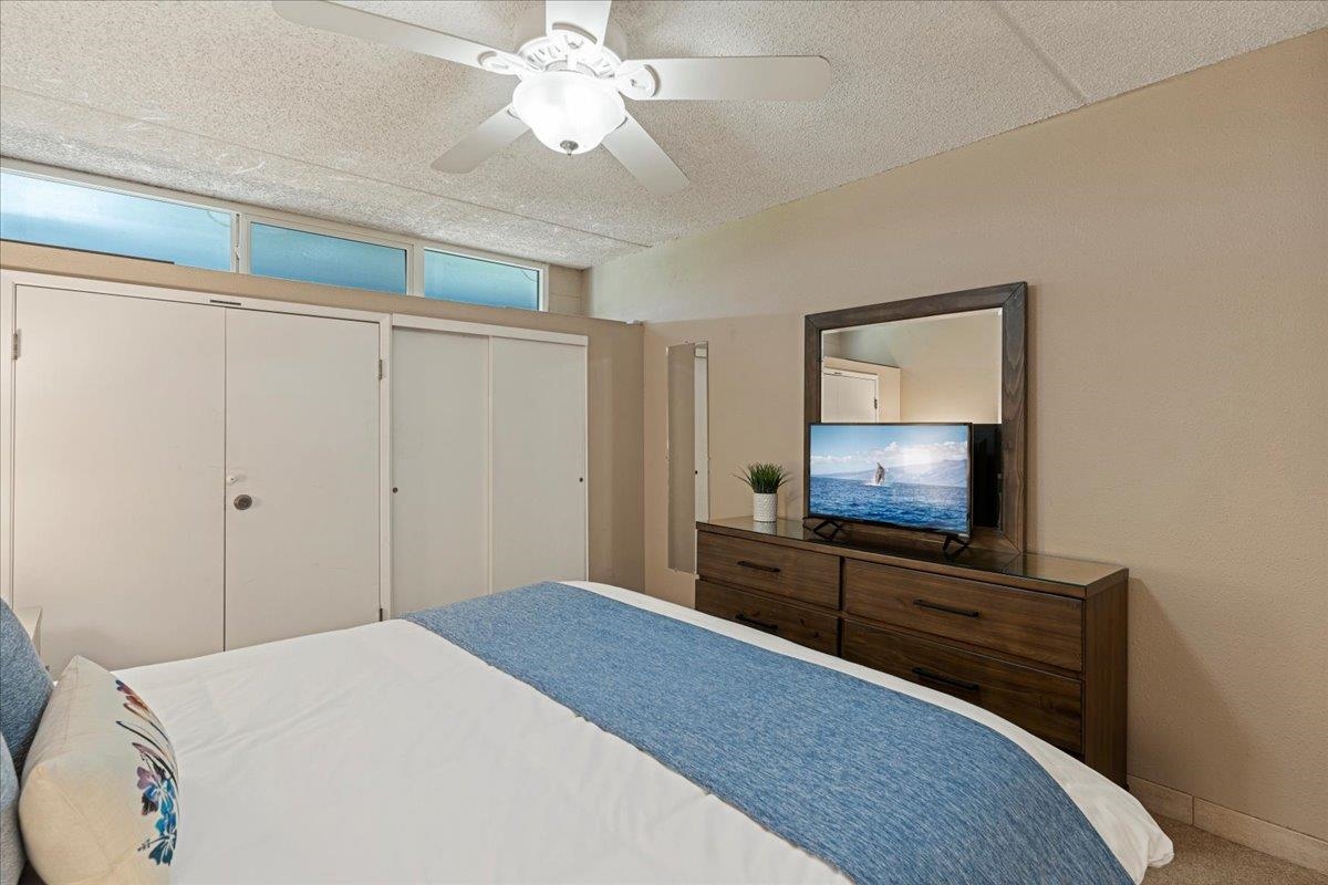 2531 South Kihei Road, Unit C317 Kihei, HI 96753 - Photo 28 of 32 a bedroom with a bed and a flat screen tv