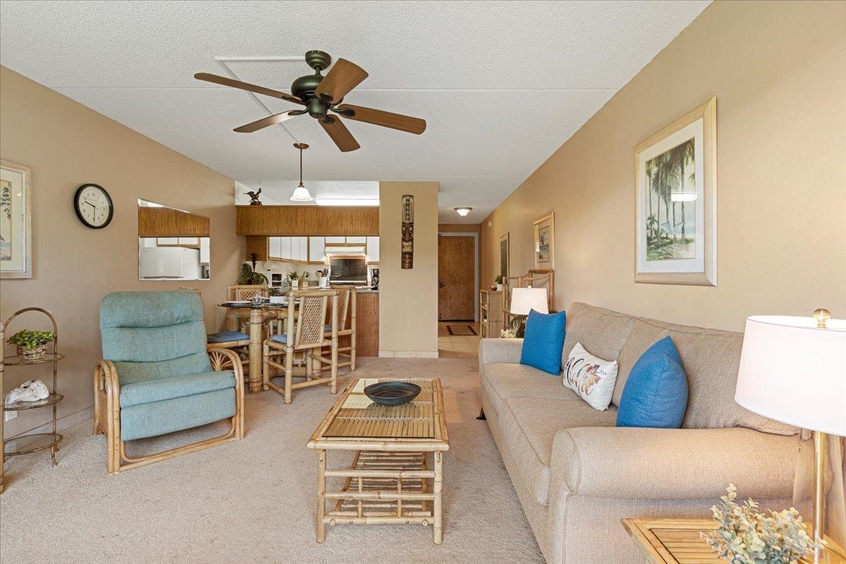 2531 South Kihei Road, Unit C317 Kihei, HI 96753 - Photo 4 of 32 a living room with furniture and a chandelier