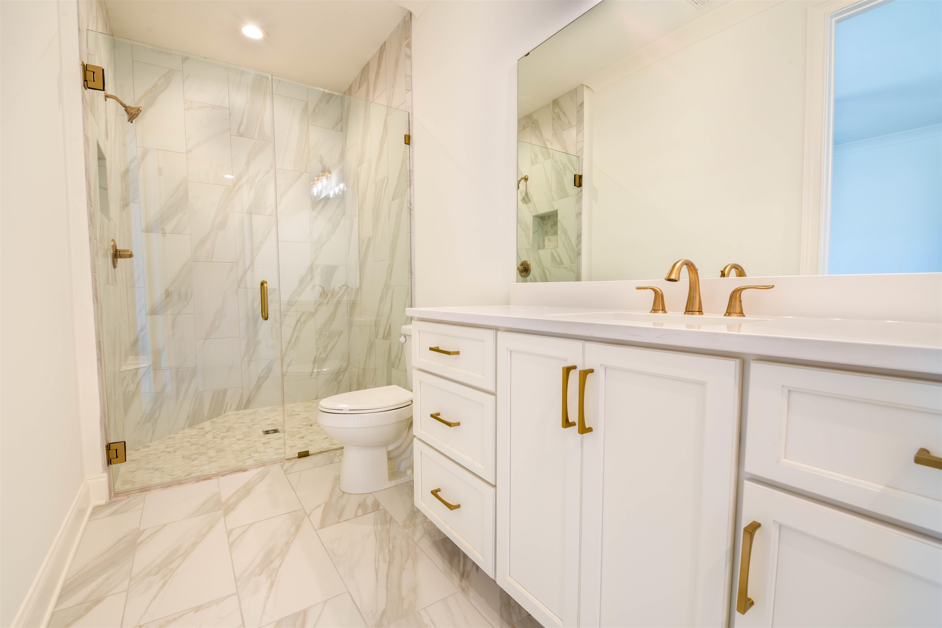 30 Rambling Rex Trail Piperton, TN 38017 - Photo 16 of 27 Bathroom with vanity, toilet, marble finish floor, and a marble finish shower